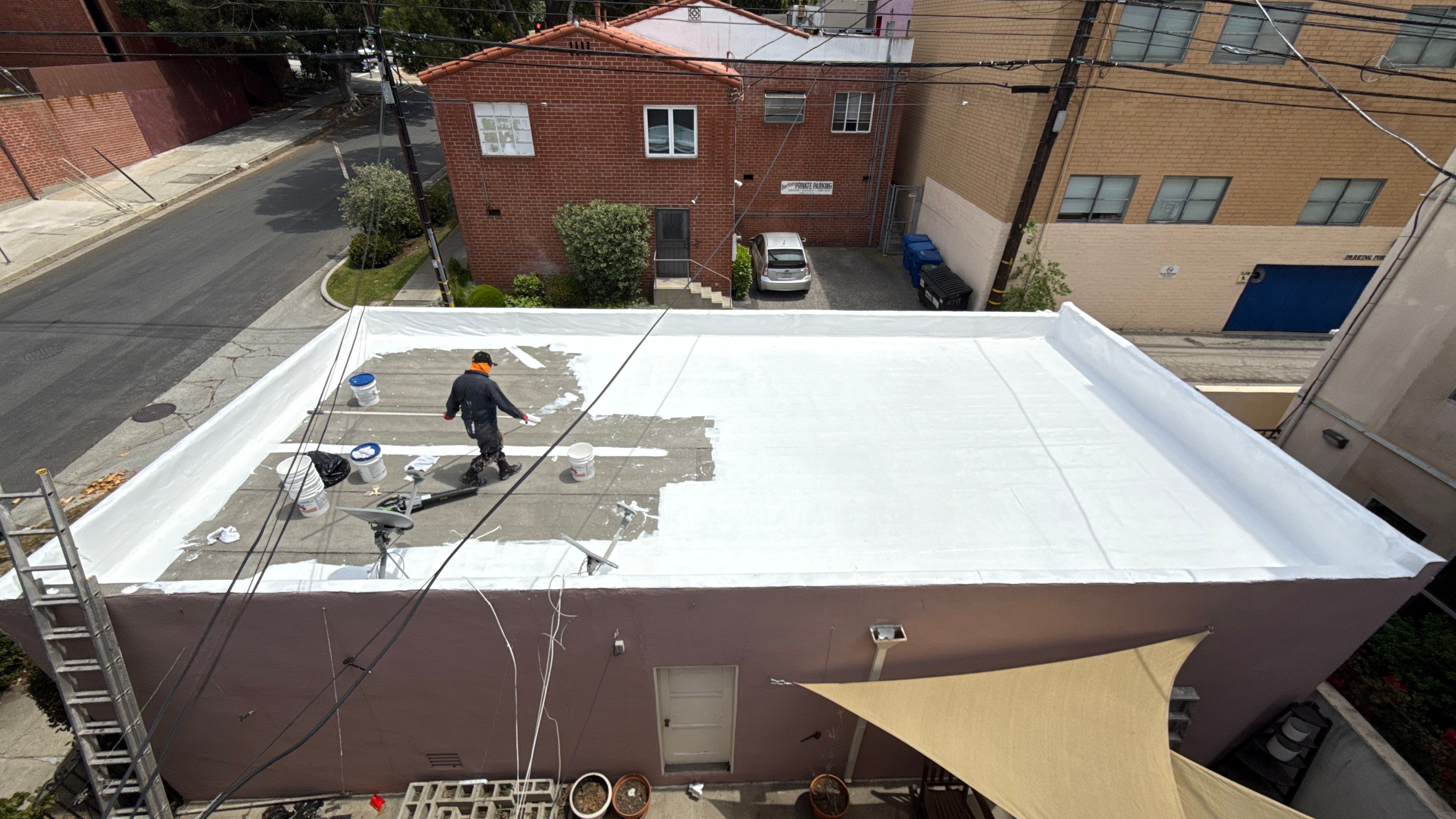 Apartment Building 2nd Layer Installation &Silicone coating by Hull Brothers Roofing