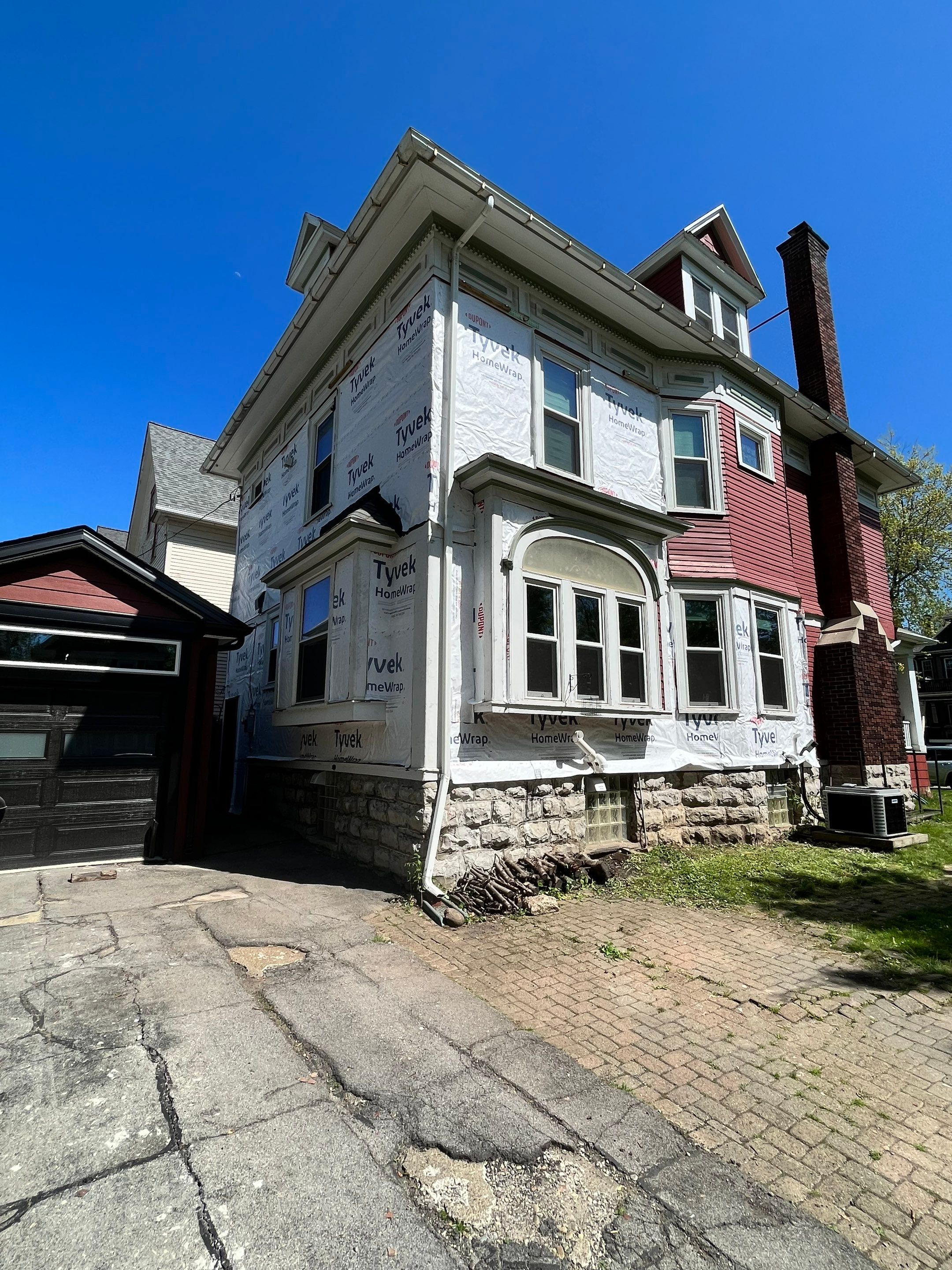 Exterior Renovations- Siding, Stamped Concrete, Porch, and Railings by Ivy Lea Construction