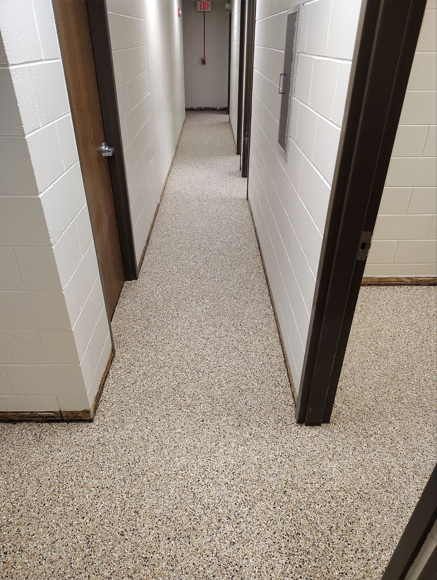 Industrial Flake Epoxy Floor Installation at Pierre National Guard Facility by Select Painting, Coatings & Garage Cabinets
