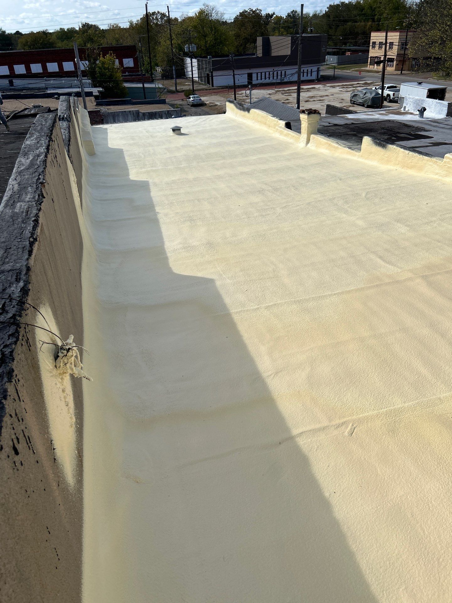 Downtown Gladewater Commercial Foam Roof Restoration – SPF + High-Tensile Acrylic by All Star Roofing LLC