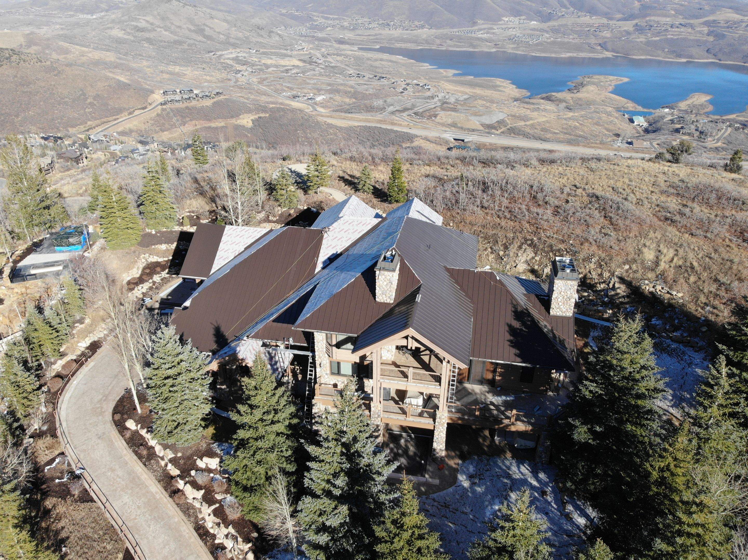 Standing Seam Metal Roof Replacement After Snow Damage by ASAP Roofing & Restoration