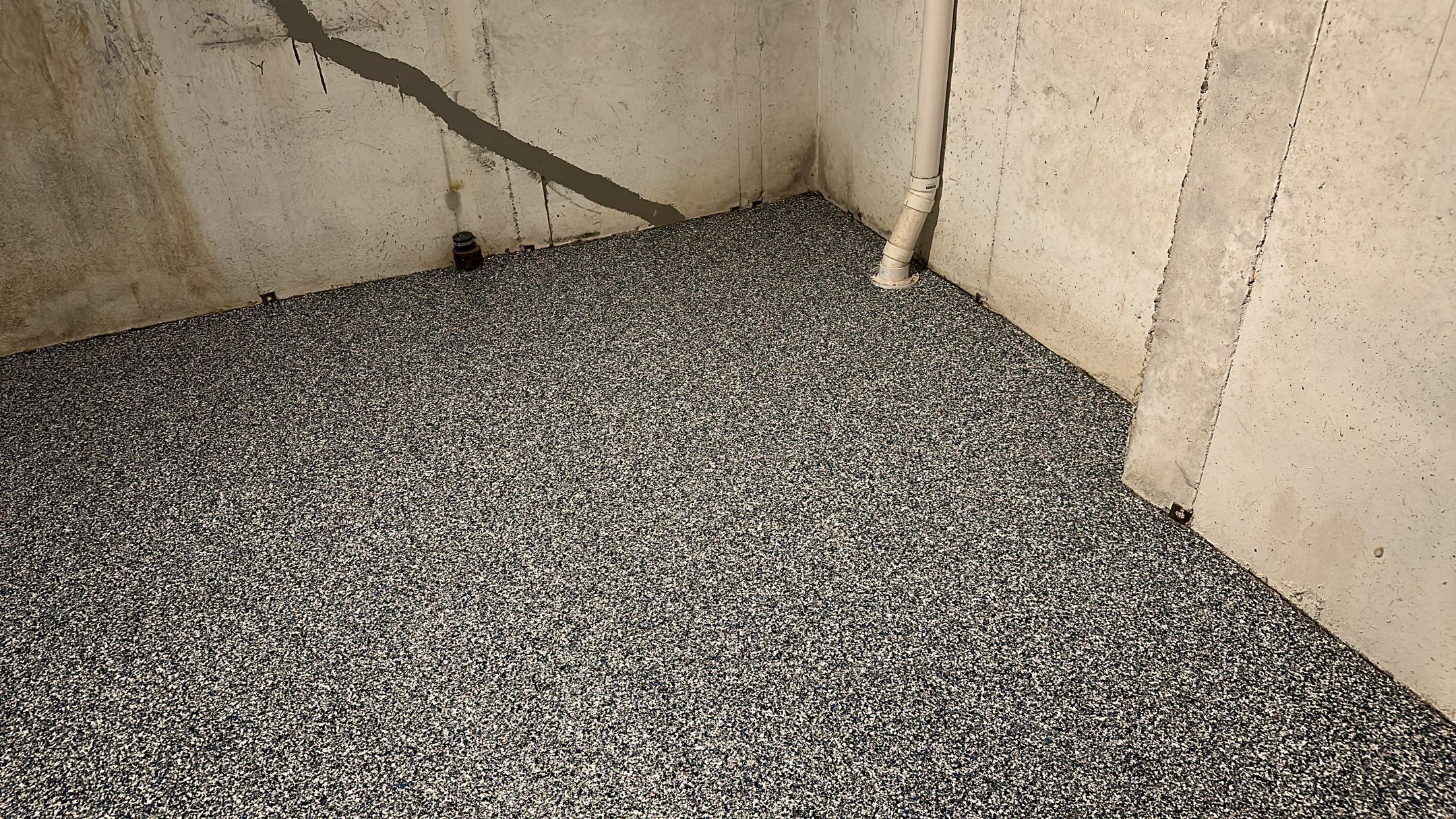 A beautiful Banner Garage Coating in a basement  by Banner Garage