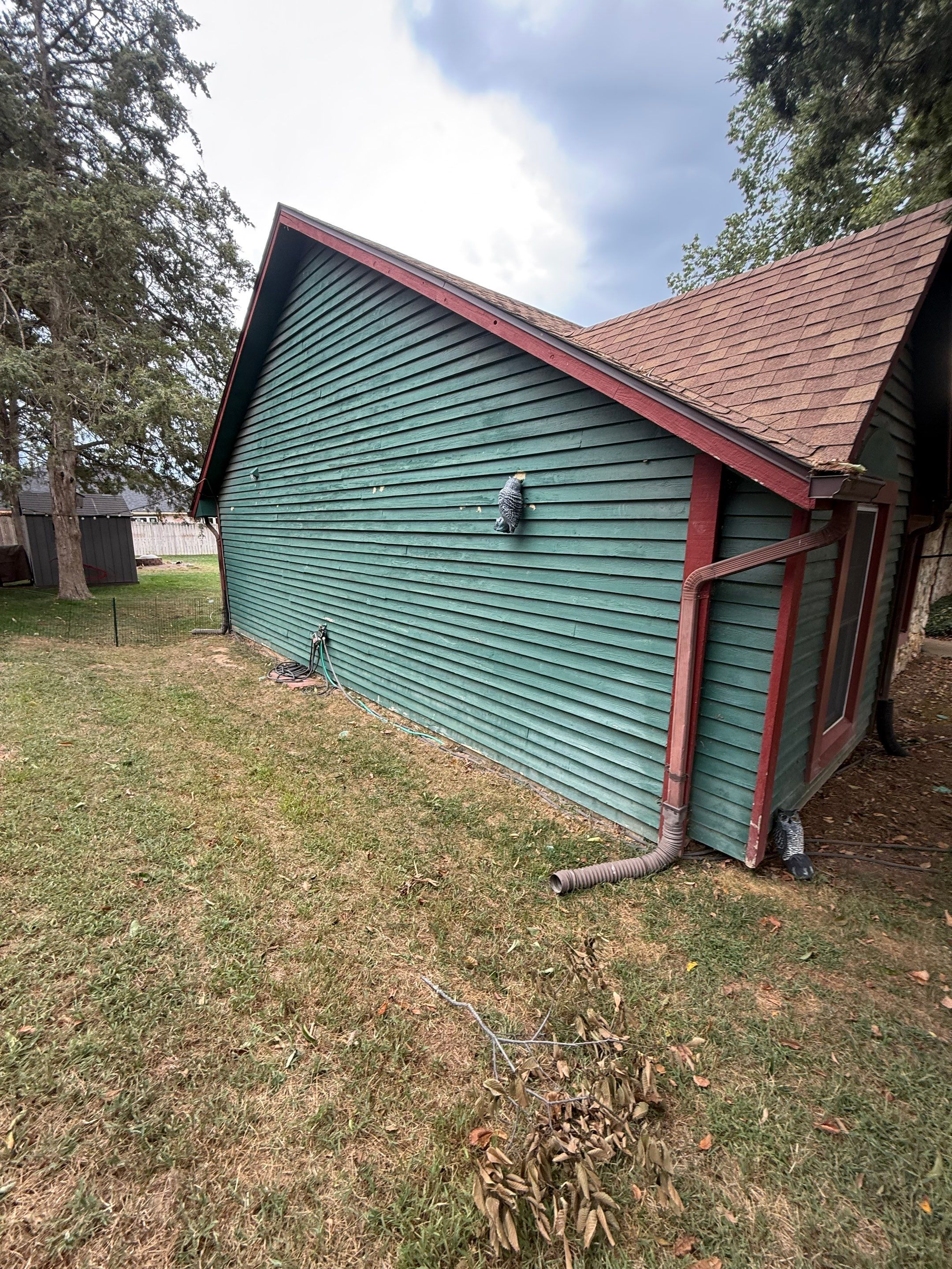 Wood siding refresh by Pezley Painting