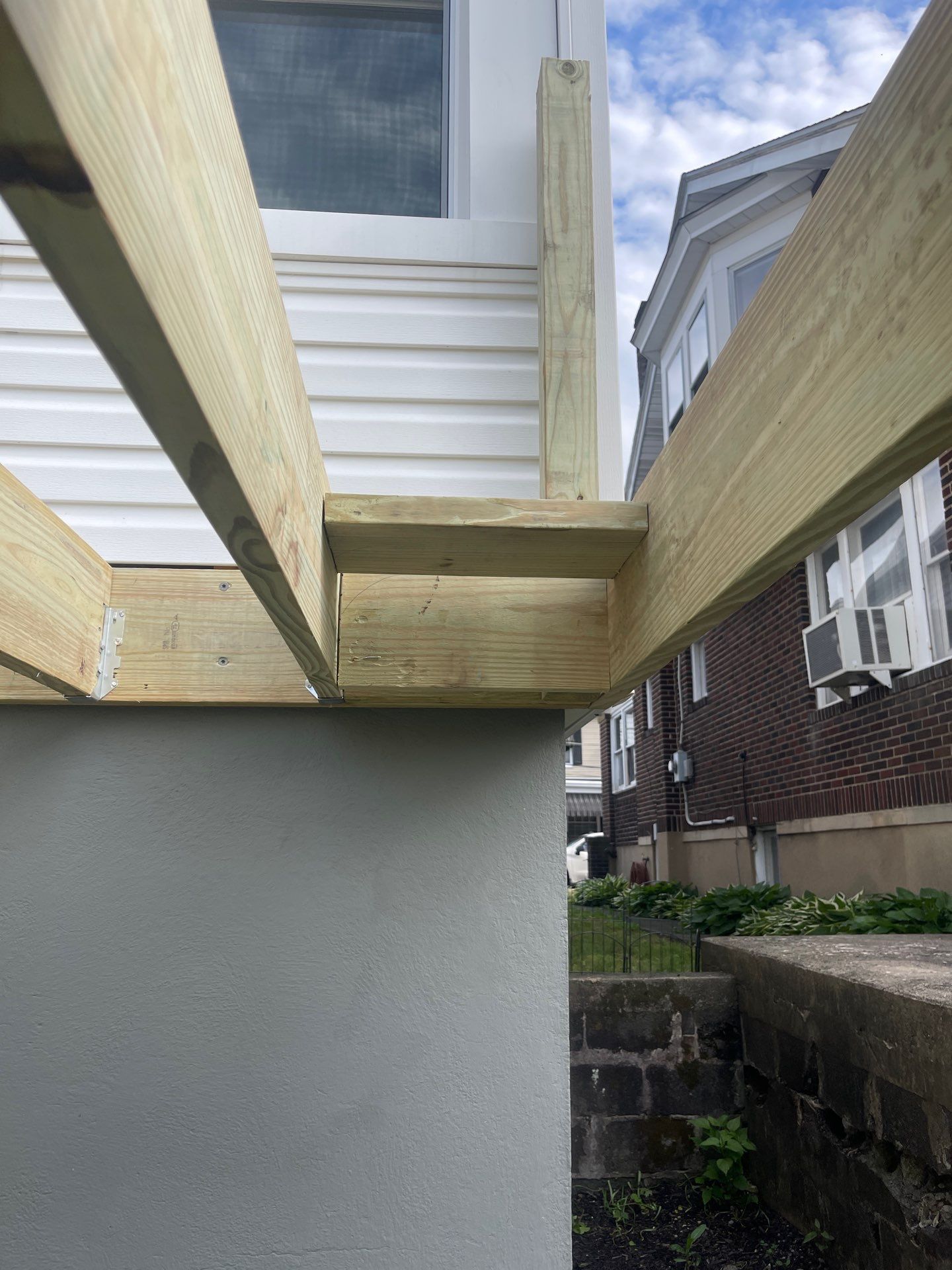 Pressure-Treated Wooden Staircase and Concrete Footing Installation in Schuylkill Haven by Herts Roofing & Construction