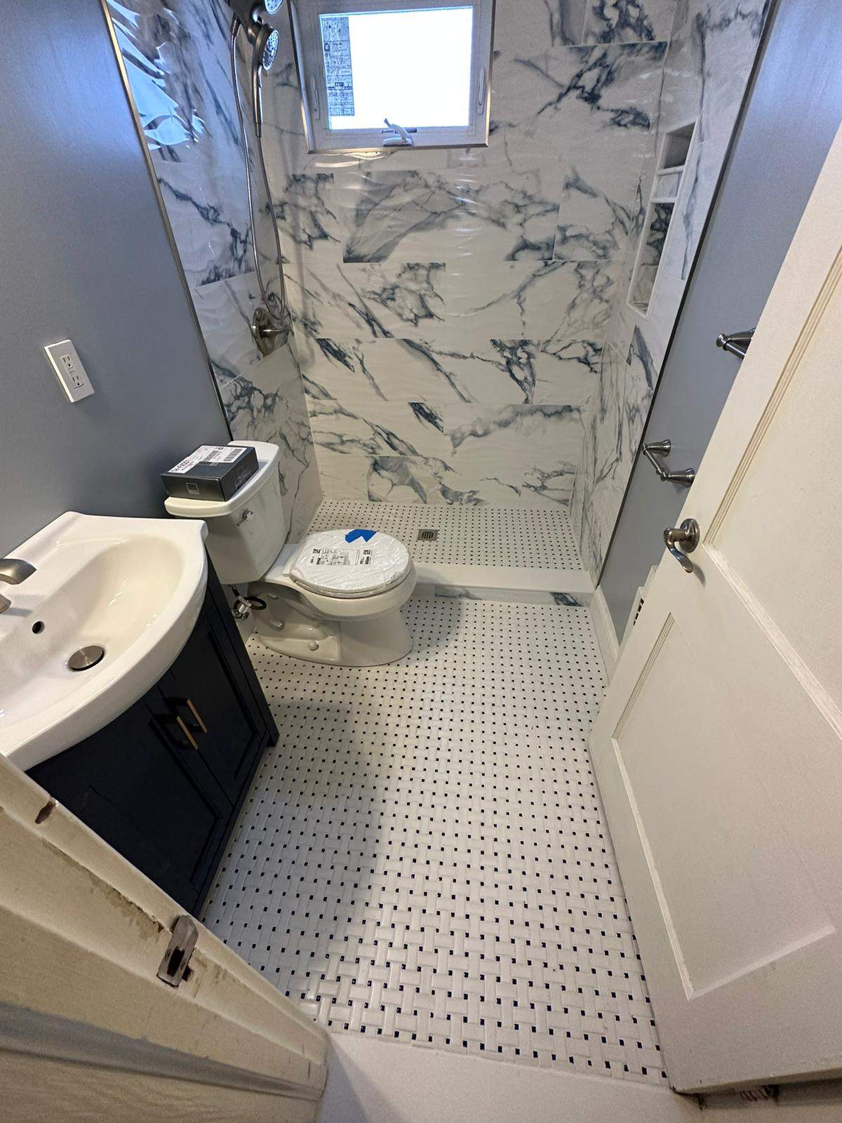 Bathroom Remodel using Tile by Home Concepts Construction