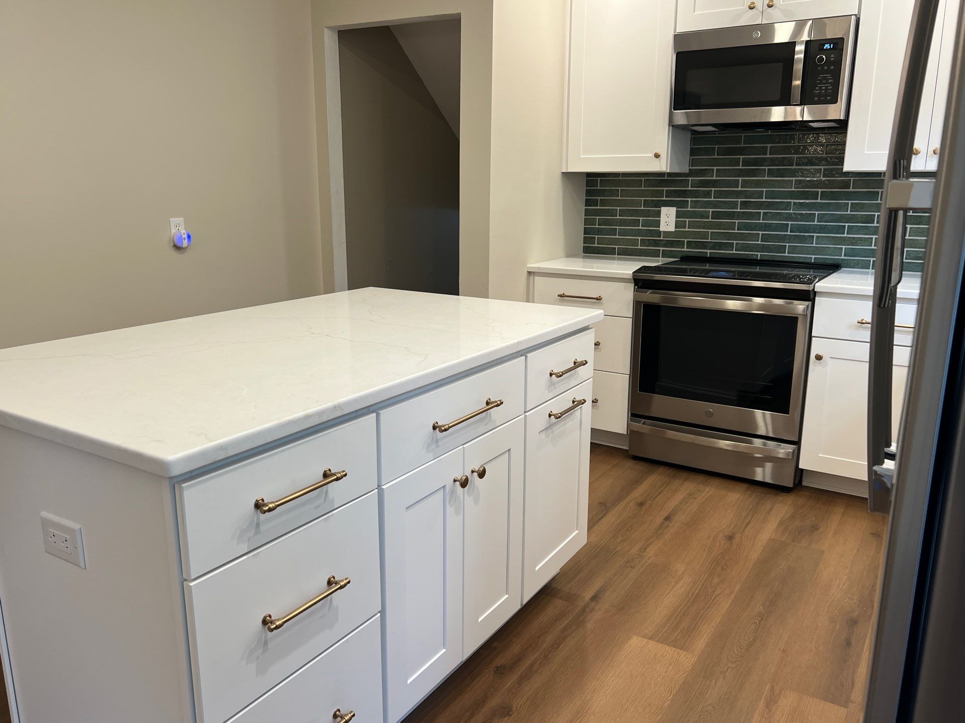 Phoenixville Kitchen Remodel with White Shaker Cabinets and Green Backsplash by Reliable General Contracting