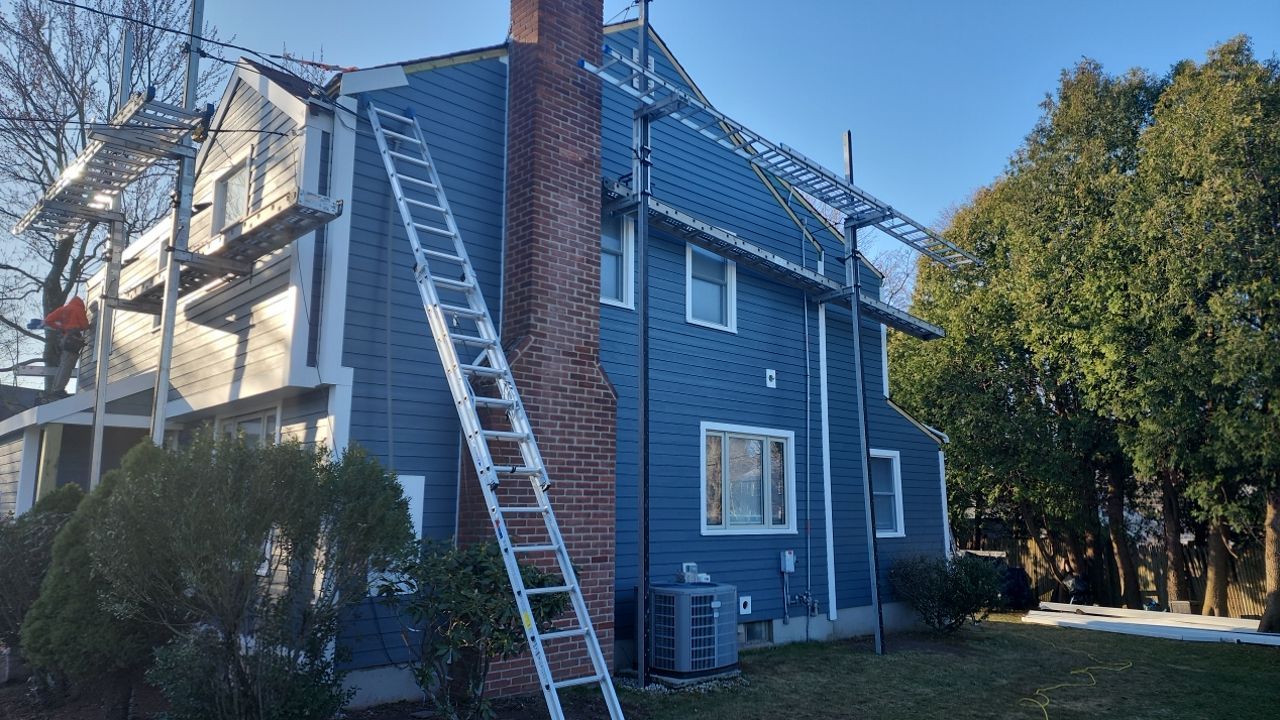 James Hardie siding, new metal roof and couple windows being installed. by UBrothers Construction
