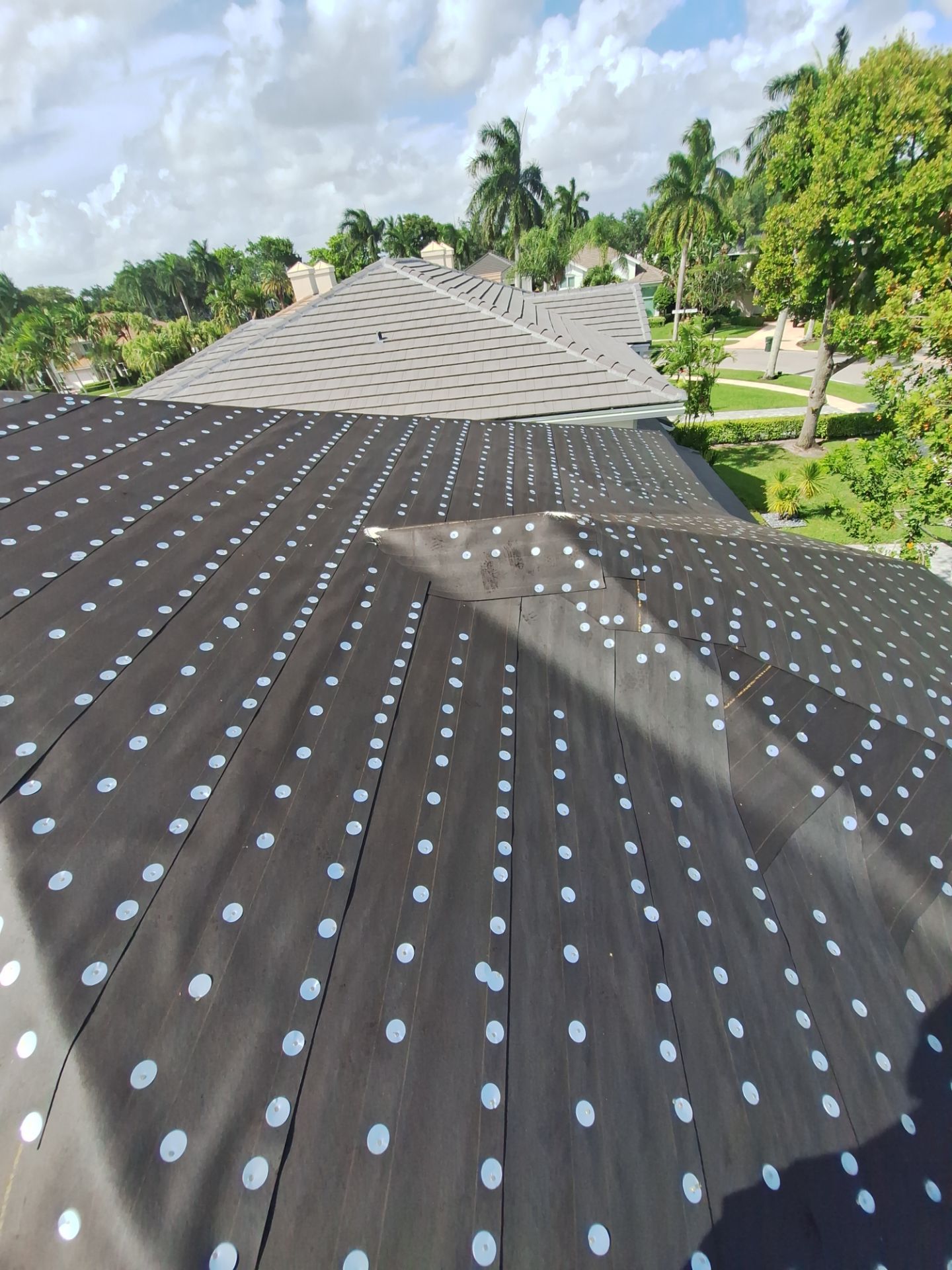 Residential Roofing Installation using 1" Nail strip metal roof by BLUES BROTHERS ROOFING