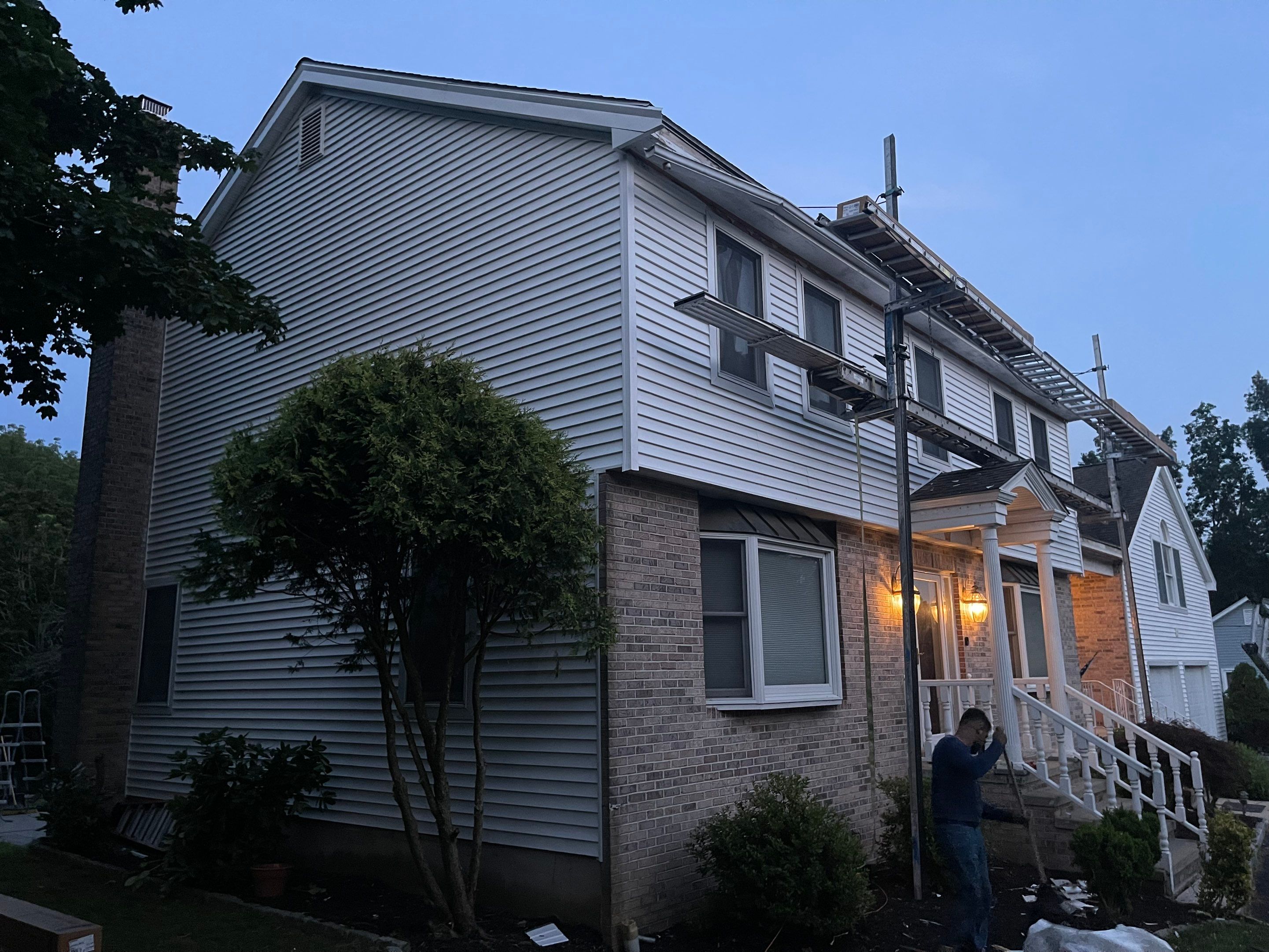 Siding Installation using Mainstreet Colonial & White gutters by A Plus Exterior
