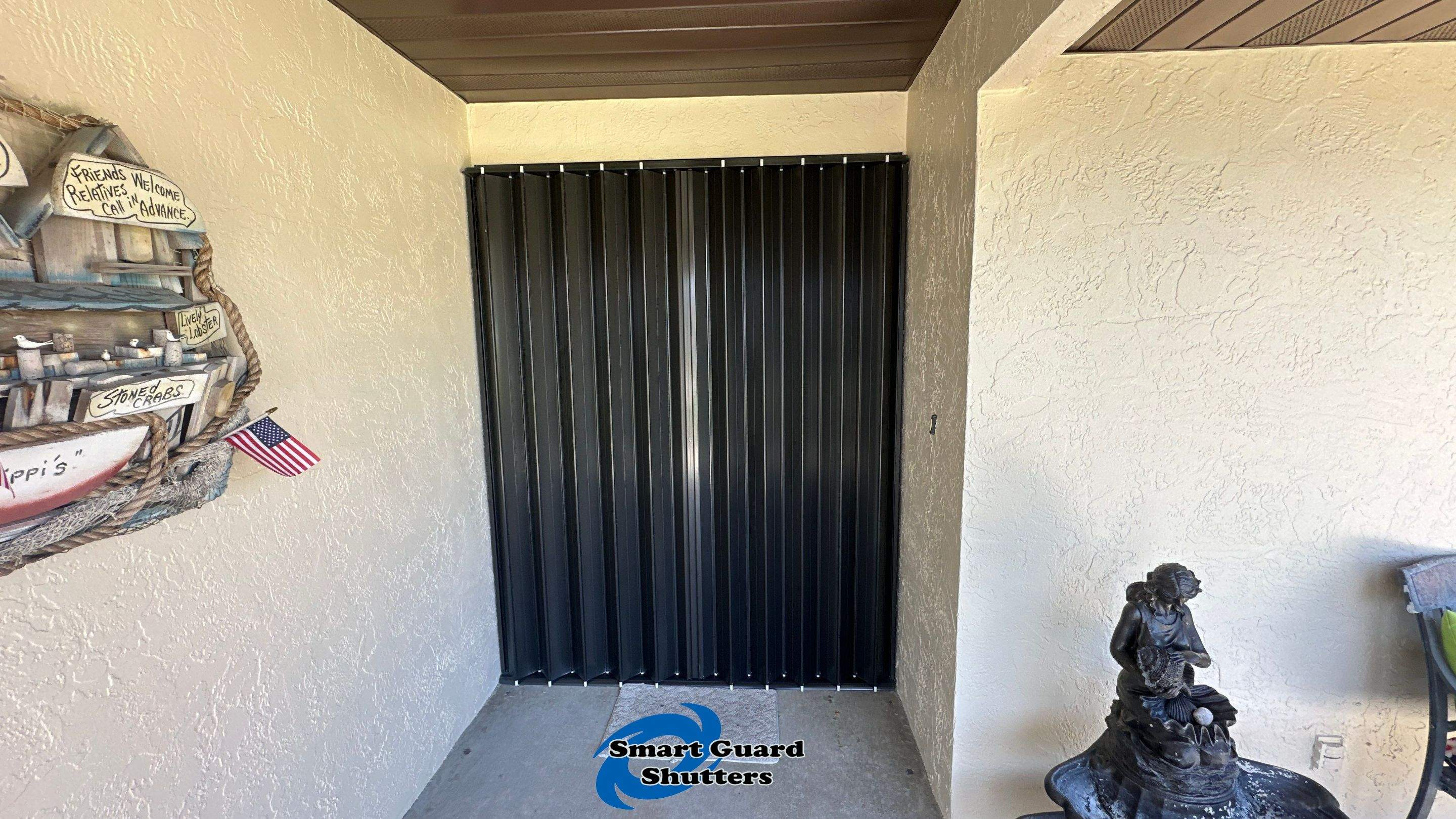 Accordion Shutter in Bronze by Smart Guard Shutters