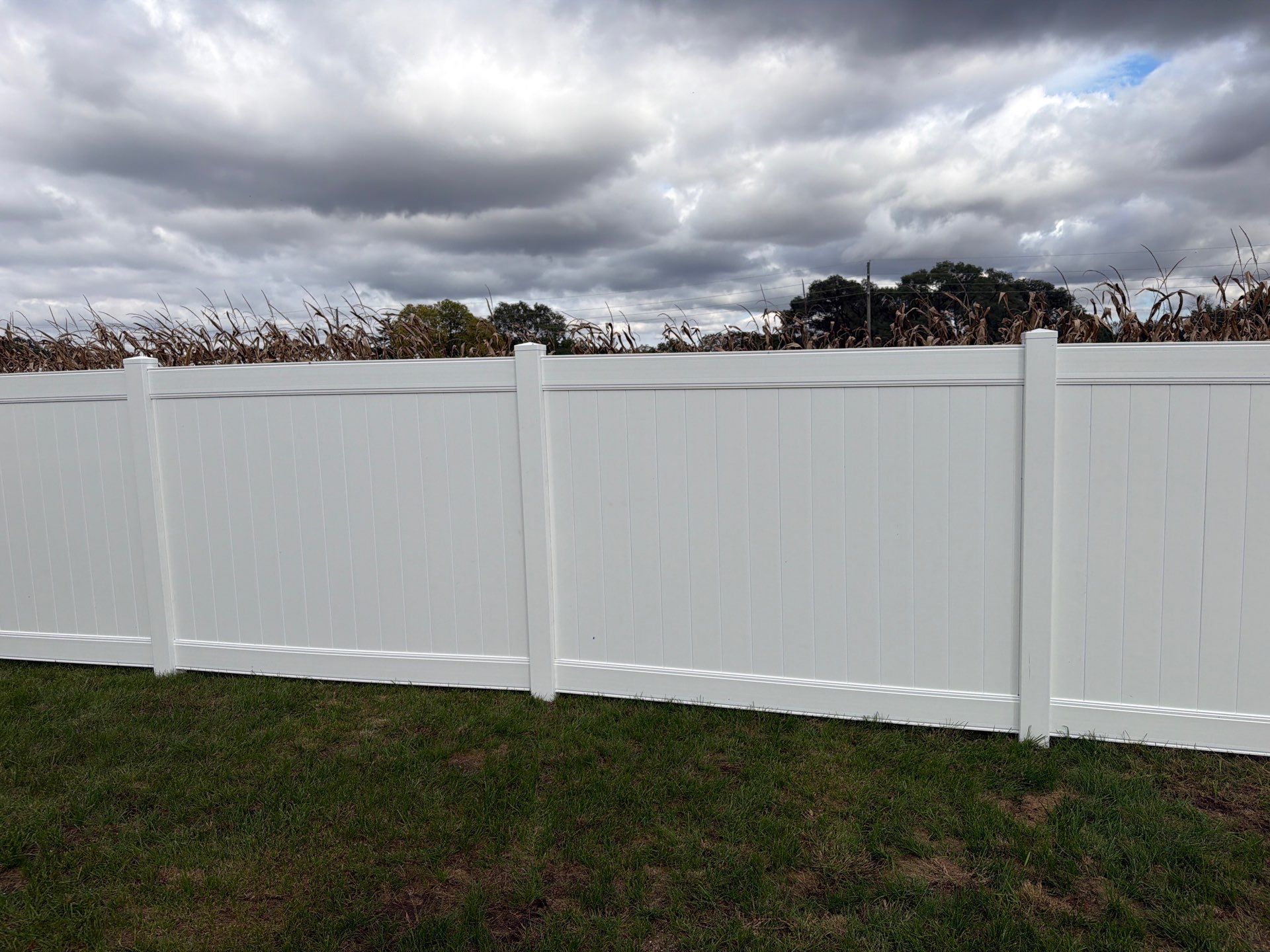 Residential White Vinyl Privacy Fence Installation in Janesville by Perfect Picket Fence and Stain
