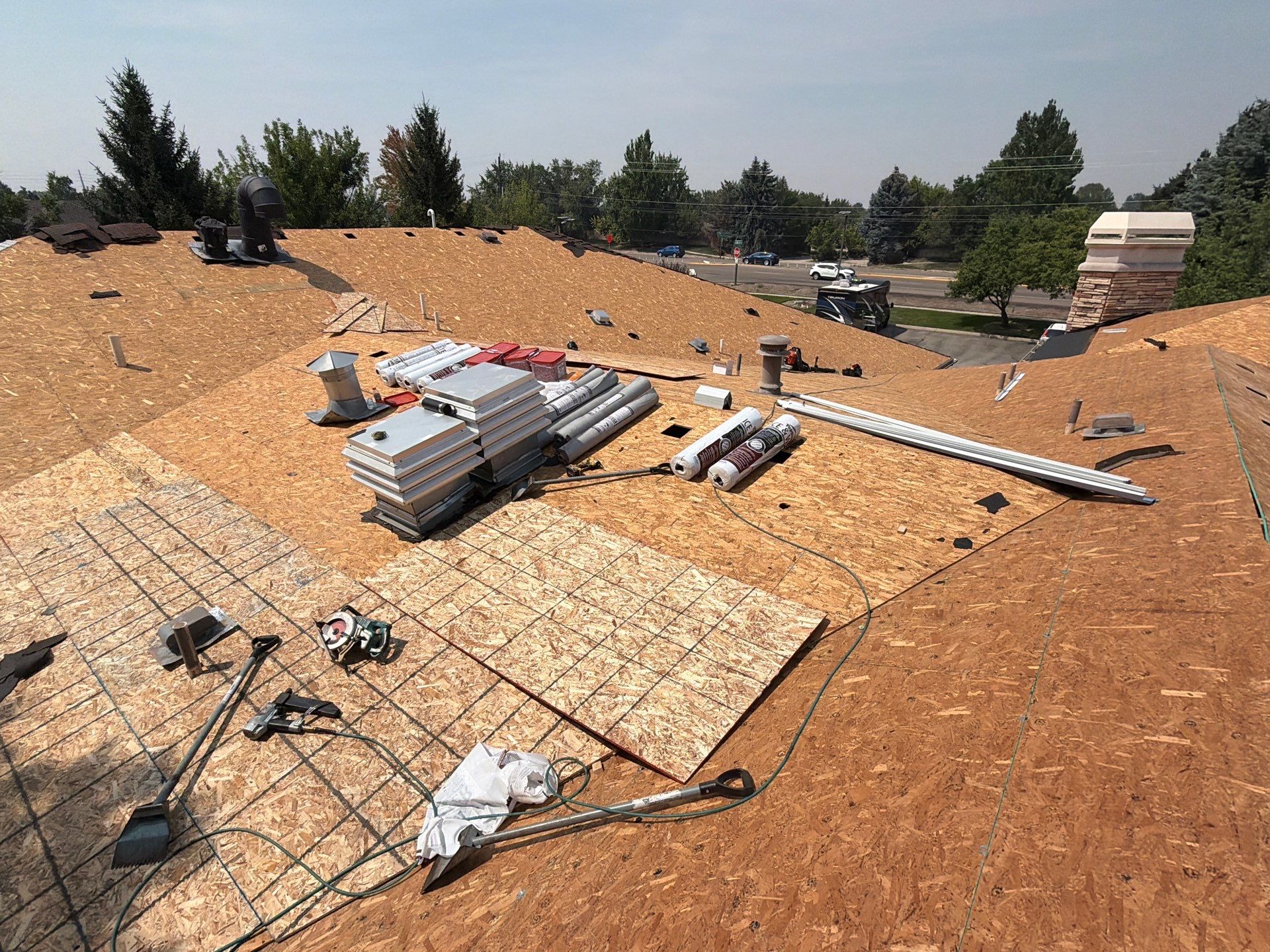 Boise Commercial Roof Replacement with Brown Architectural Shingles by Olive Roofing