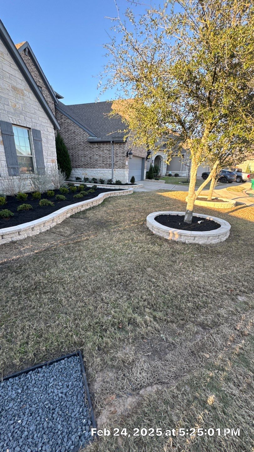 🌿✨ Darlene & Andrew’s Amazing Curb Appeal Transformation  Some projects are more than just landscaping—they’re a conversion of curb appeal from the ground up. For Darlene & Andrew, Alejandro and the Texas Urban Team designed and delivered a complete solution that reshaped their flower beds, solved drainage challenges, and gave new life to the sideyard.  💡 From planning to execution, every step was tailored to build both beauty and functionality:  🌸 Flower Beds, Reinvented  Demolition of old beds, plants, and mulch.  Fresh soil preparation, weed protection, and a brand-new retainer wall built with hand-cut stone and decorative caps.  Carefully selected plants and garden mix to ensure health and visual harmony.  💧 Drainage & Irrigation Upgrades  Outdated corrugated pipes replaced with PVC drainage lines to carry water safely away from the foundation.  New irrigation system combining drip lines and sprinklers—watering plants while keeping the house walls protected.  Sideyard drainage extended with catch basins and PVC piping to prevent water pooling and foundation stress.  🚶 Functional Sideyard with Walkway & Trash Area  Graded and leveled sideyard to manage runoff.  Installed a modern gravel and paver walkway for easy access.  Built a firm and tidy concrete-paver pad for trash containers—making the space both practical and polished.  🛠️ Stonework & Craftsmanship  Every stone in the retainer wall was cut, set, and secured by the team of handcrafters, ensuring a durable build that doubles as a design statement.  ✅ Outcome: Darlene & Andrew’s property now has better drainage, a clean and organized sideyard, and elegant new flower beds—all designed for long-term durability and lasting beauty.  📢 Before hiring anyone, review our portfolio. Our work speaks louder than words—each project is a blend of function, protection, and design crafted to last. by Texas Urban Elements