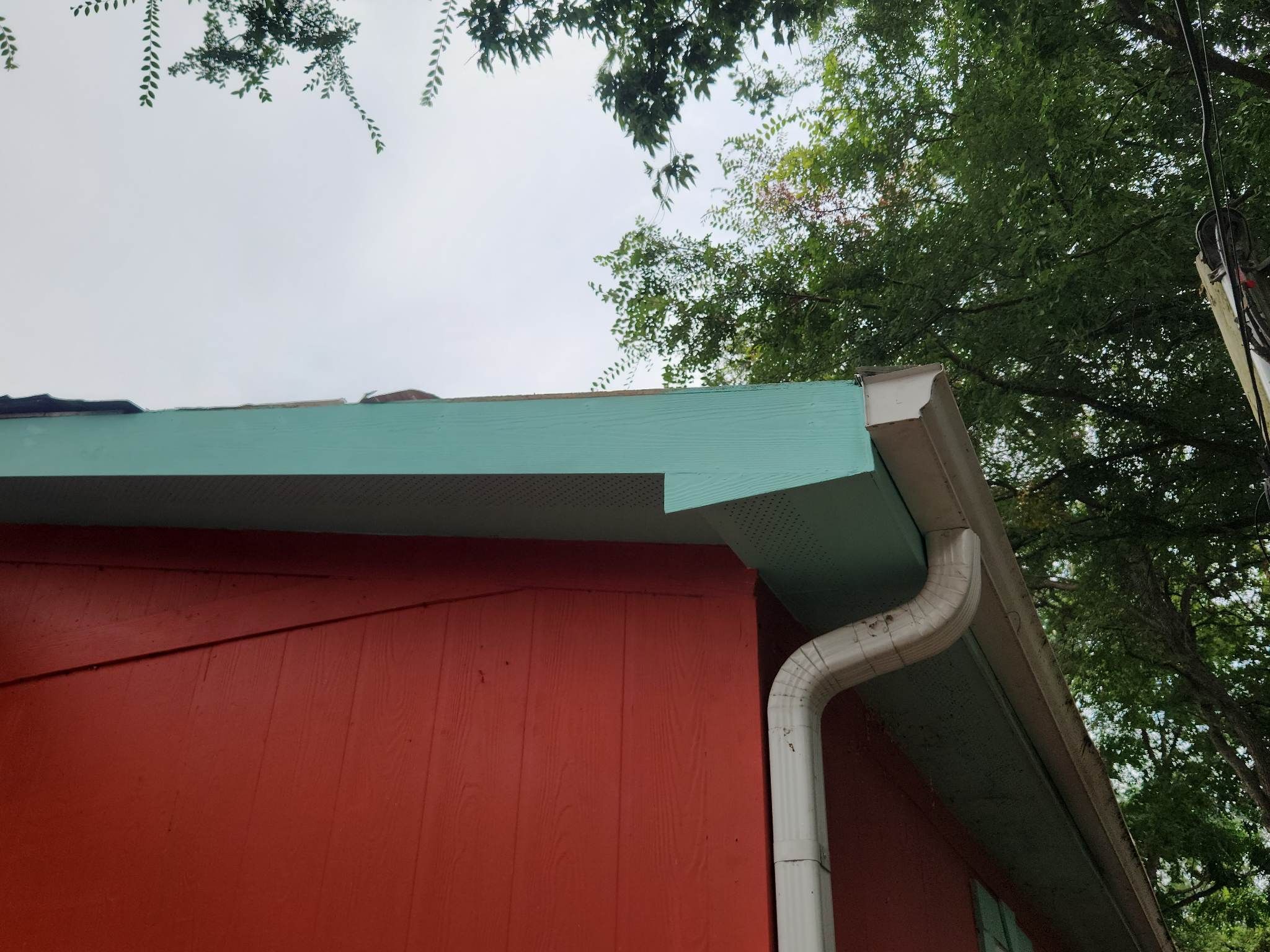 Tree Damage Roof Fascia and Soffit Repair by DeZign Roofing & Exteriors