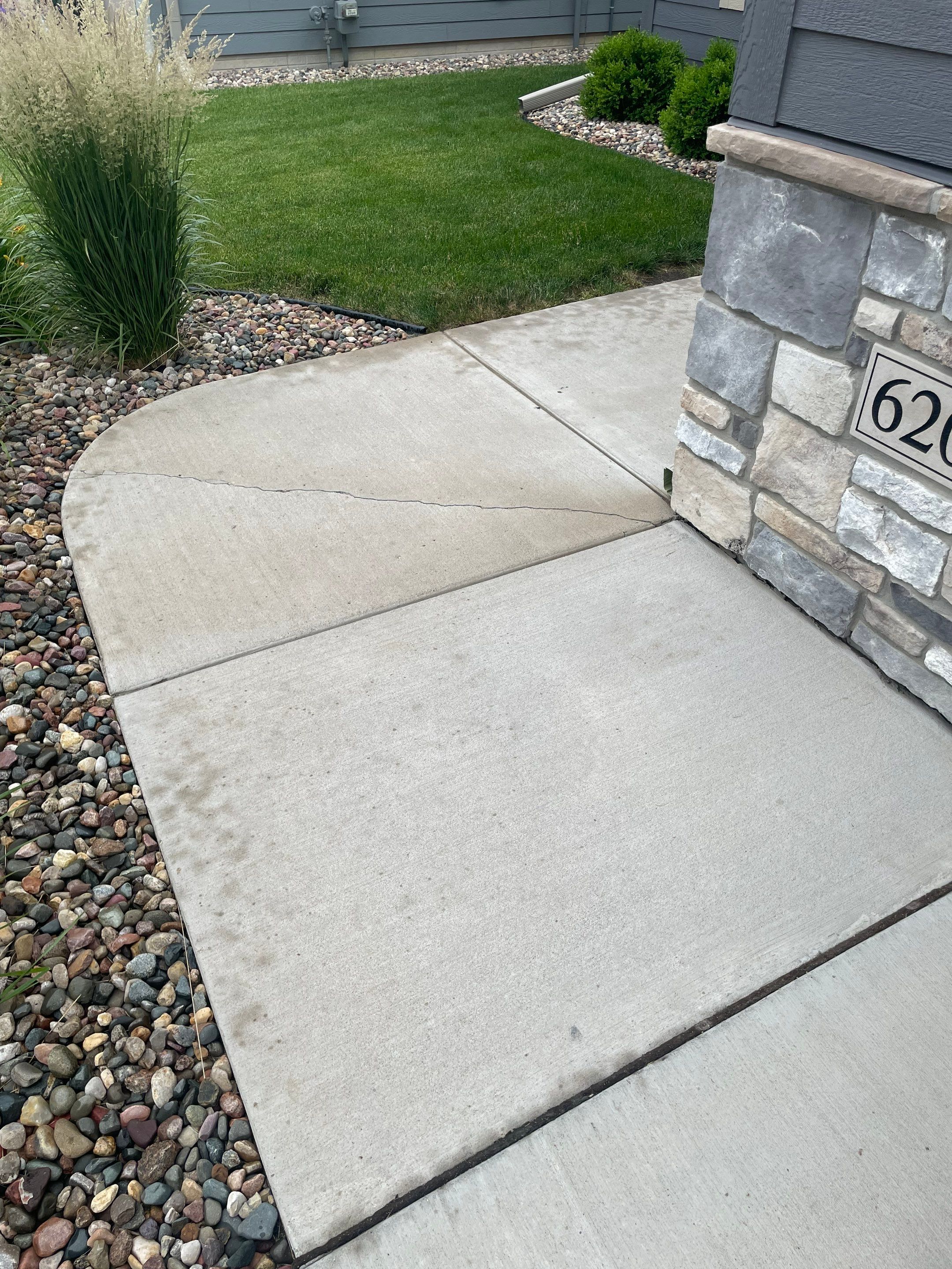 Textured Concrete Patio Coating and Custom Privacy Pergola in Sioux Falls by Select Painting, Coatings & Garage Cabinets