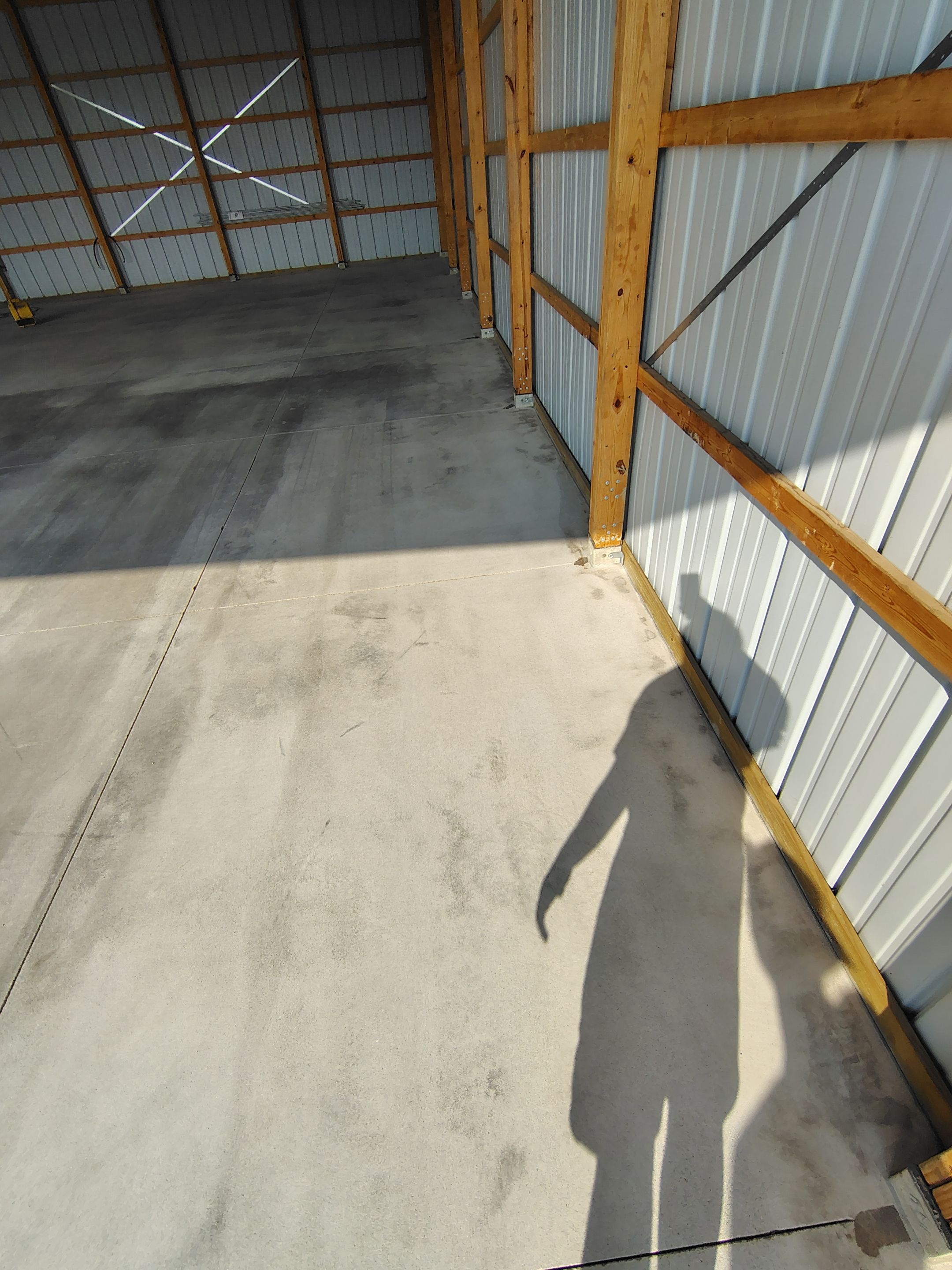 Durable Grey Speckled Epoxy Floor Coating for Yankton Shop by Select Painting, Coatings & Garage Cabinets