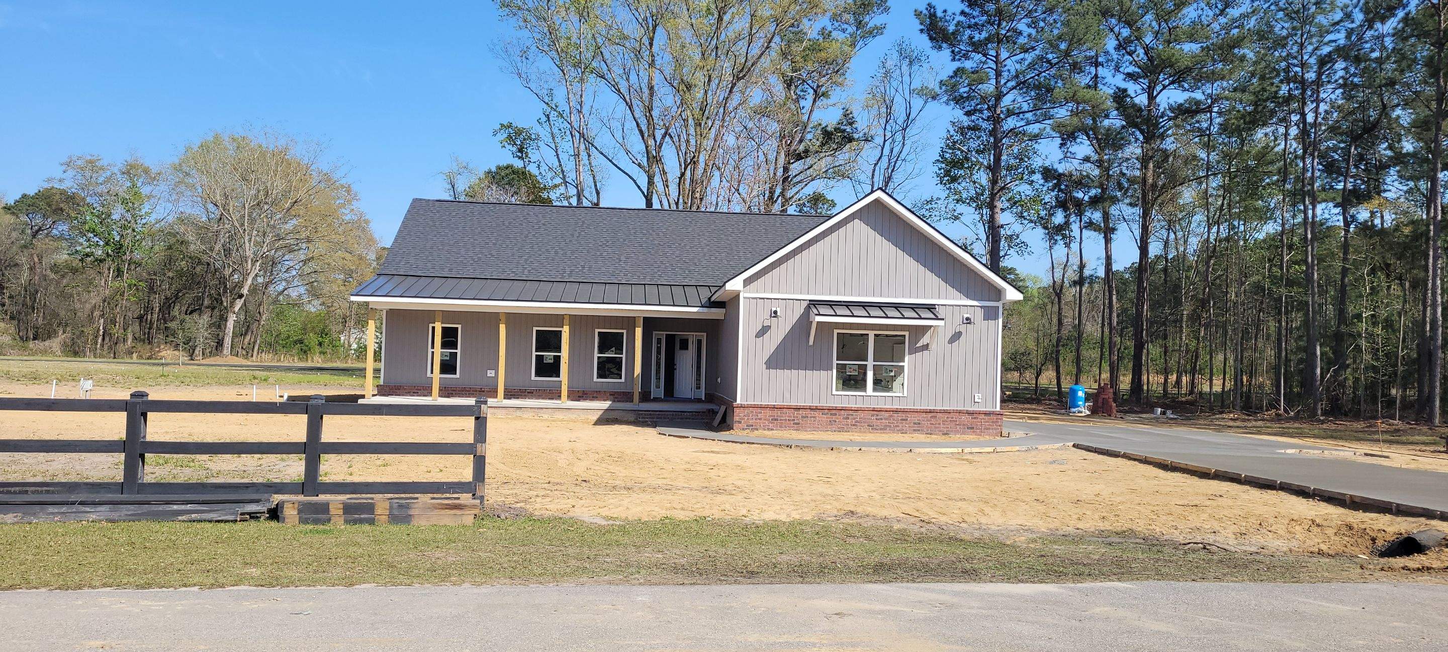 New Home Construction using brick and vertical vinyl by Cornerstone Home Builders, LLC