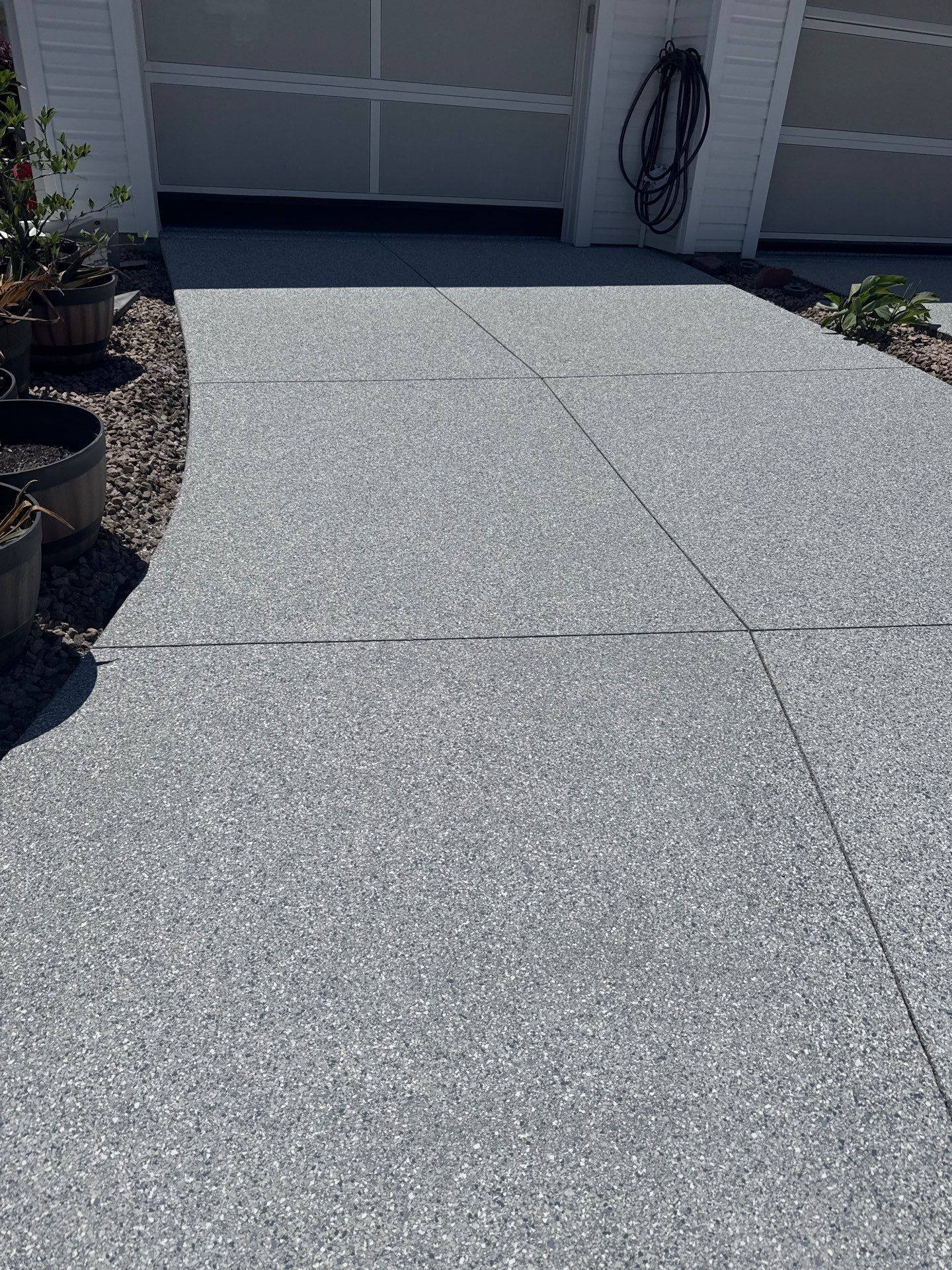 Garage, Drivewat, and Sidewalk in Landshark and Tidalwave by Innovative Concrete Coatings 