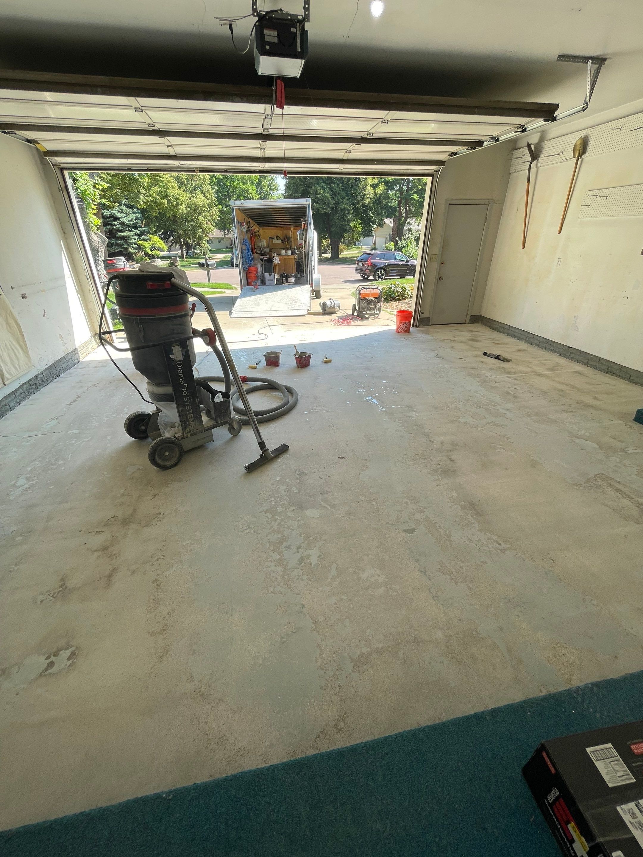 Custom Creekbed Garage Floor Coating in Sioux Falls by Select Painting, Coatings & Garage Cabinets
