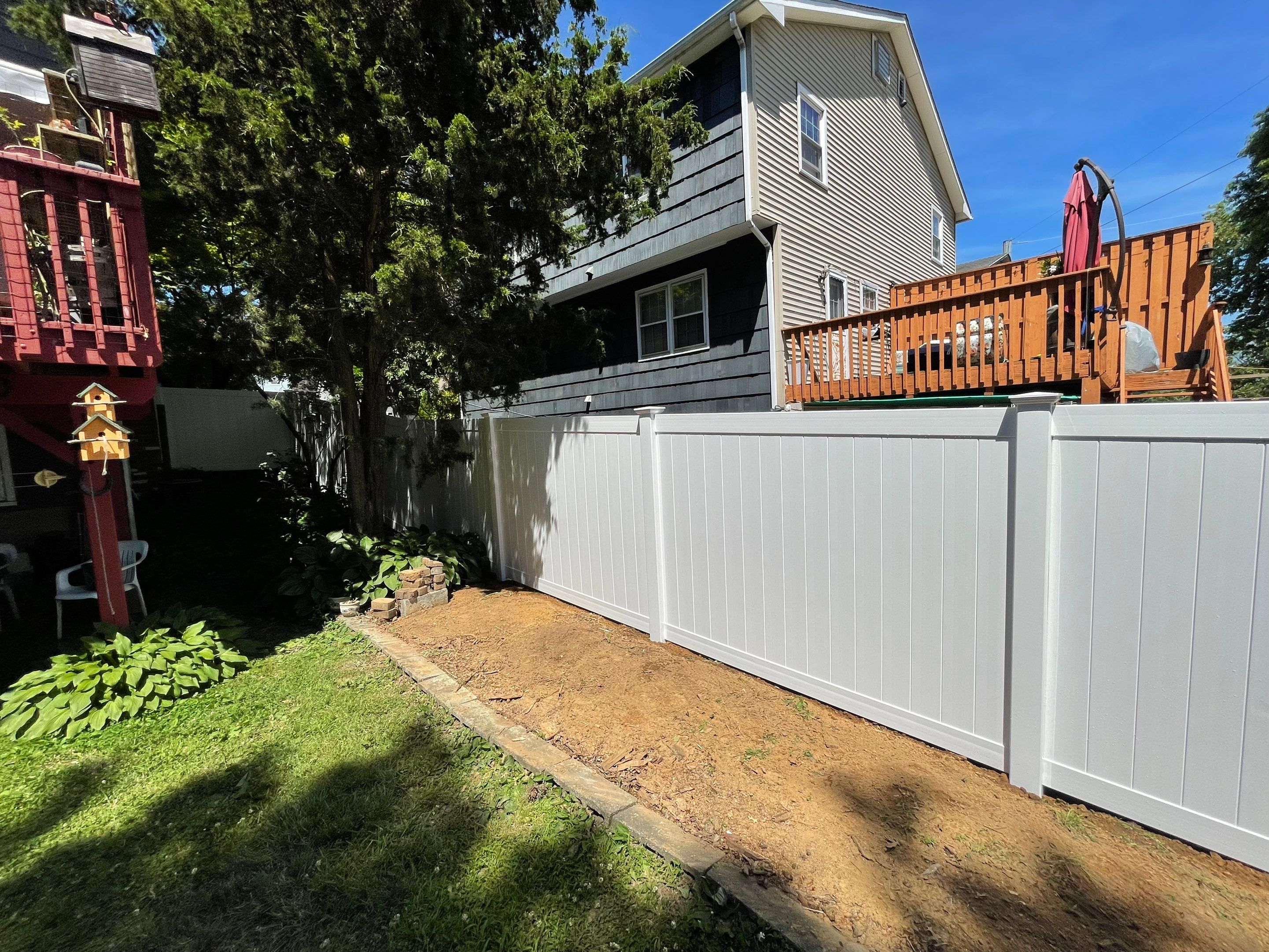 Replacement Vinyl Privacy Fence in White by DiGiorgi Roofing and Siding Inc