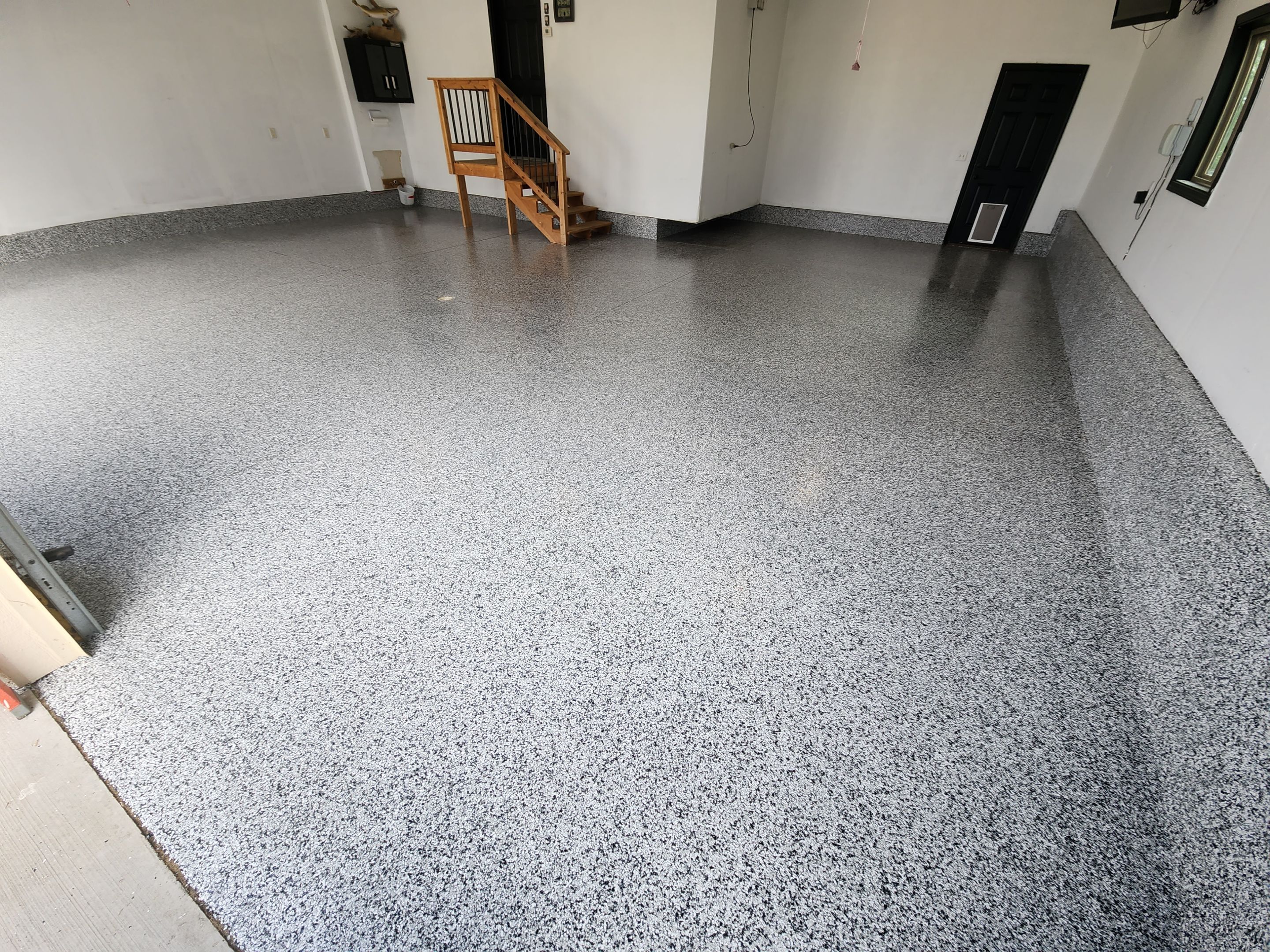Domino Flake Garage Floor Epoxy Coating in Brandon by Select Painting, Coatings & Garage Cabinets