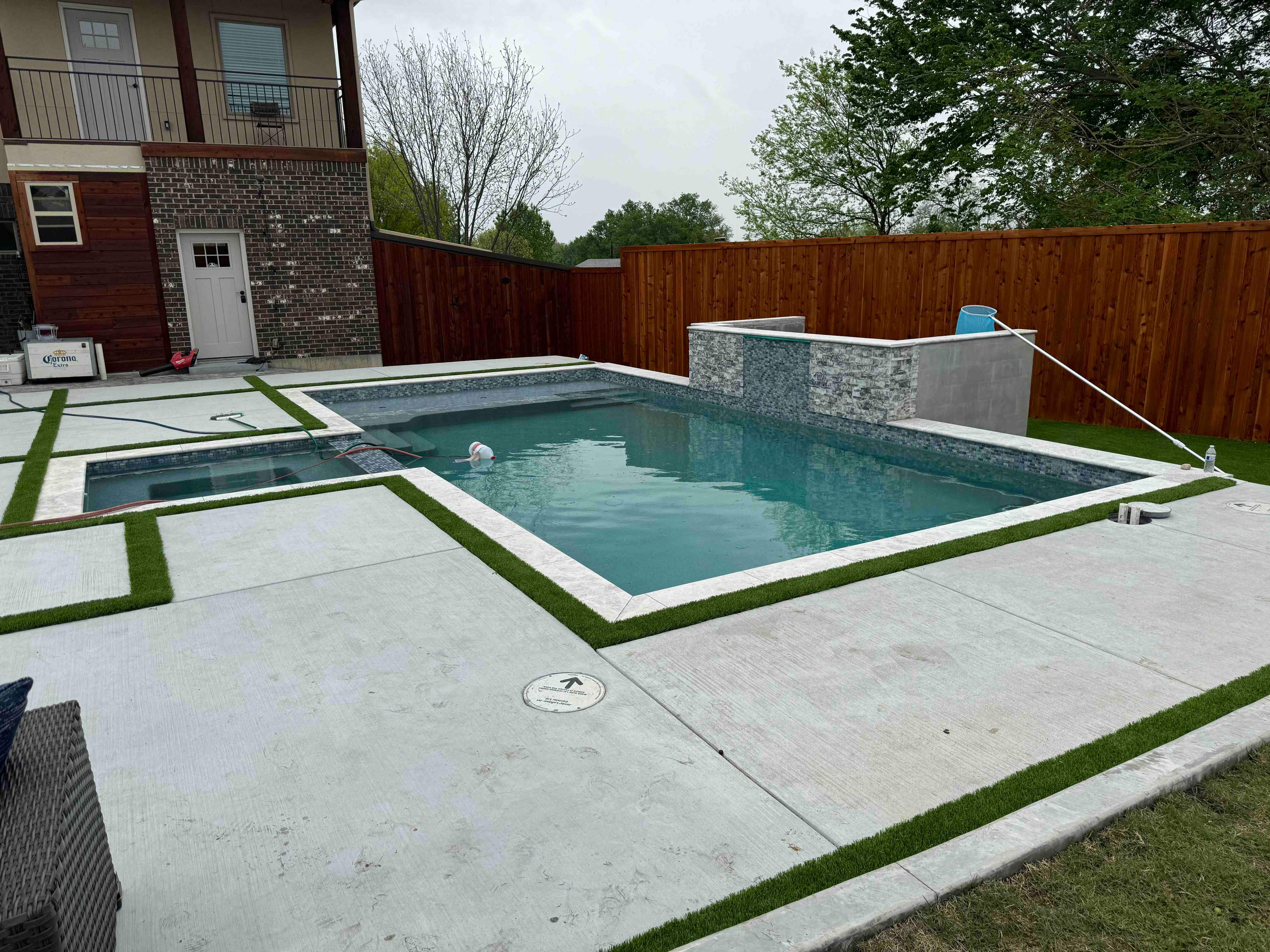 Geometric Pool with Raised Spa and Stone Coping by Pinnacle Pools and Spas - DFW