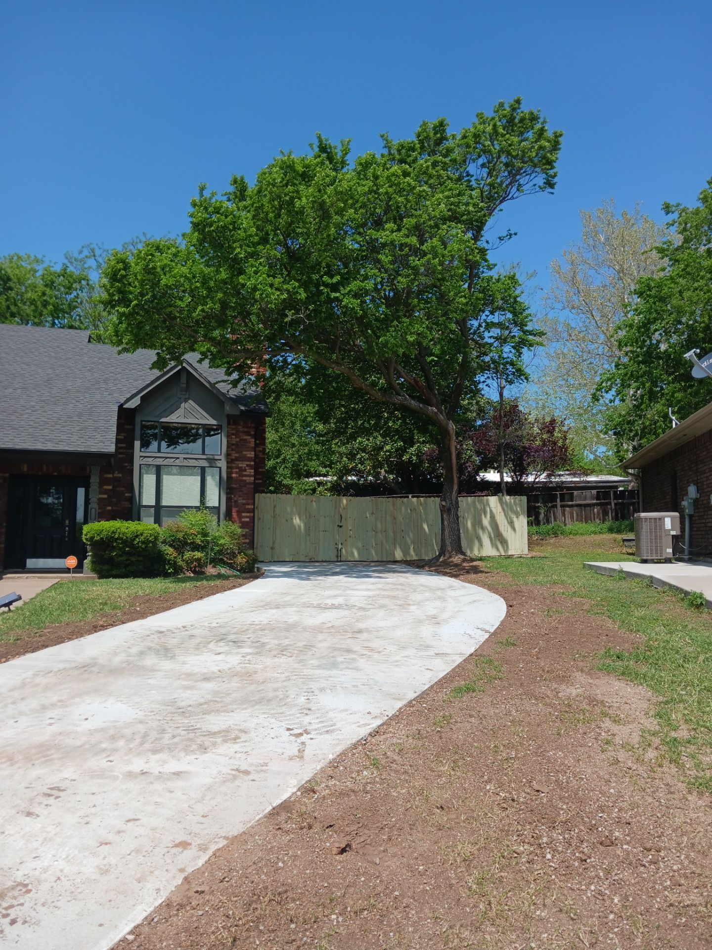 Concrete Driveway and Fence by Clays Services Inc
