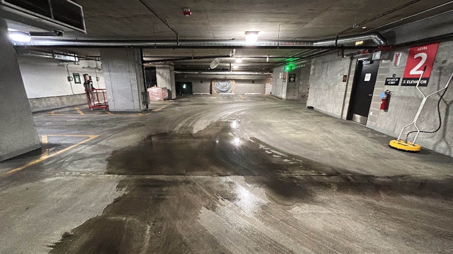 Parking garage using Hot water by Northern Power Washing LLC.