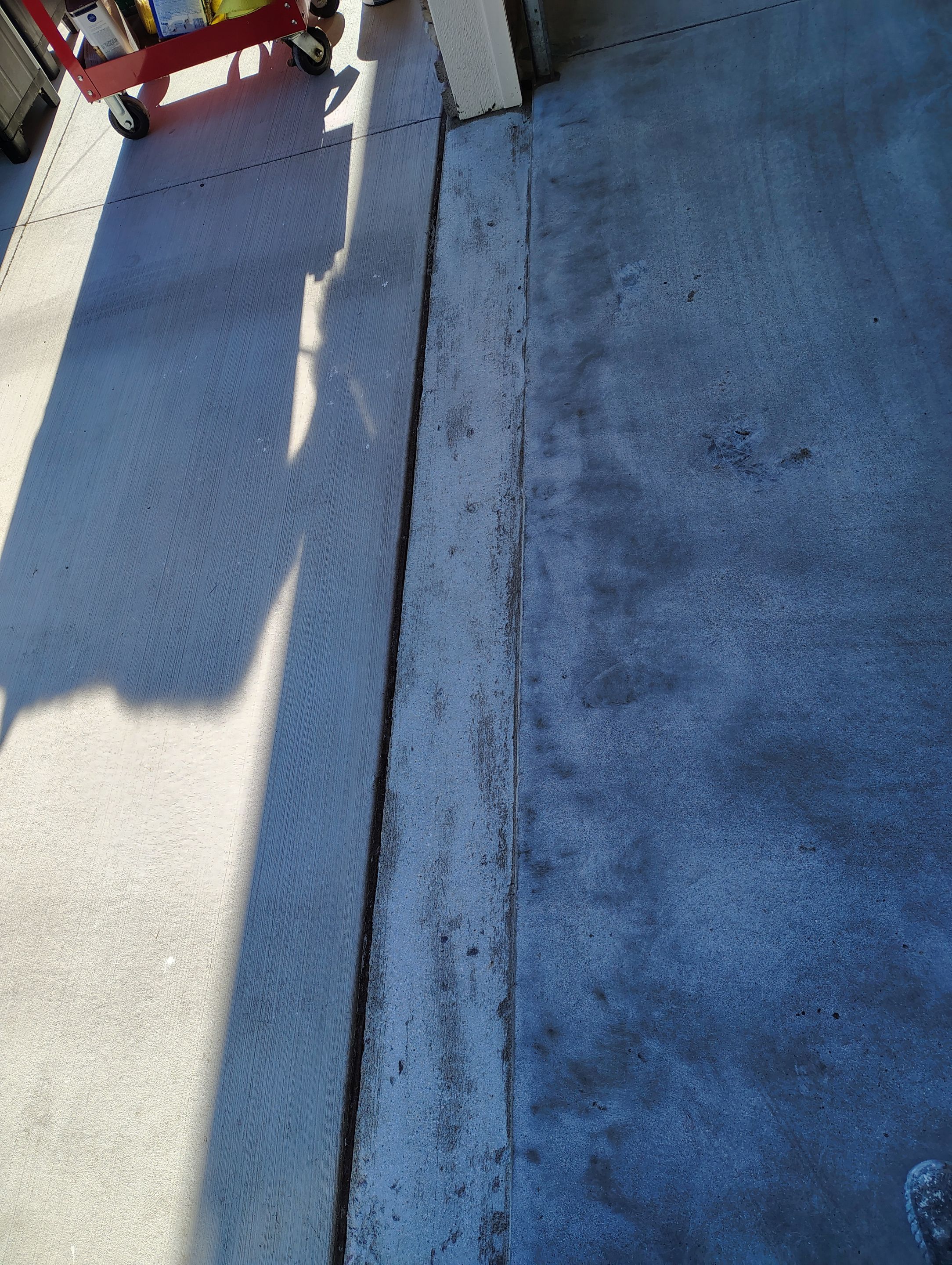 Custom Grey Speckled Epoxy Floor Coating for Sioux Falls Garage by Select Painting, Coatings & Garage Cabinets