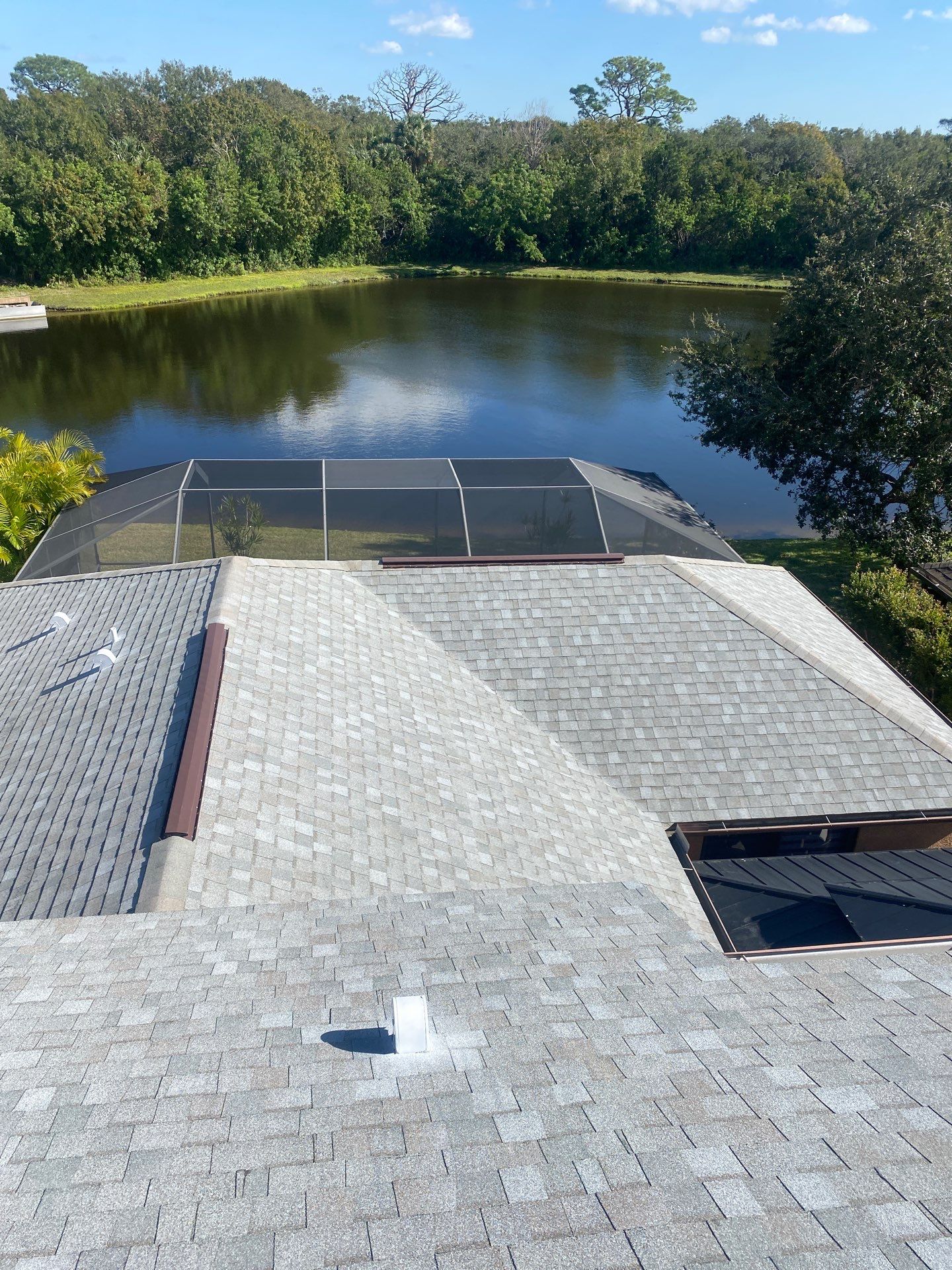 Merritt Island Roof Replacement for Two-Story Home Using Architectural Shingles by Wiedmann Construction & Roofing
