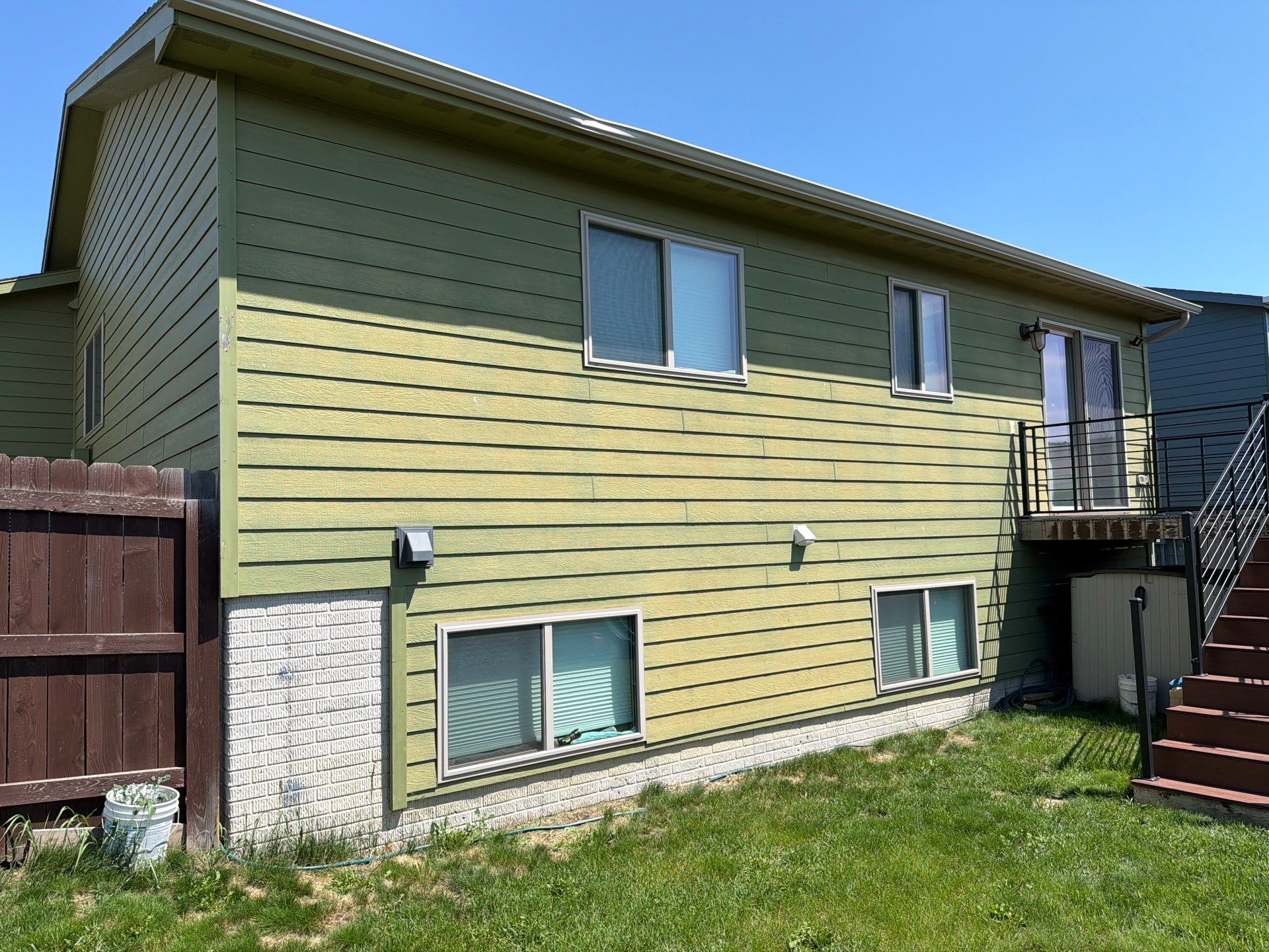 Exterior Painting and Custom Deck Construction in Sioux Falls by Select Painting, Coatings & Garage Cabinets