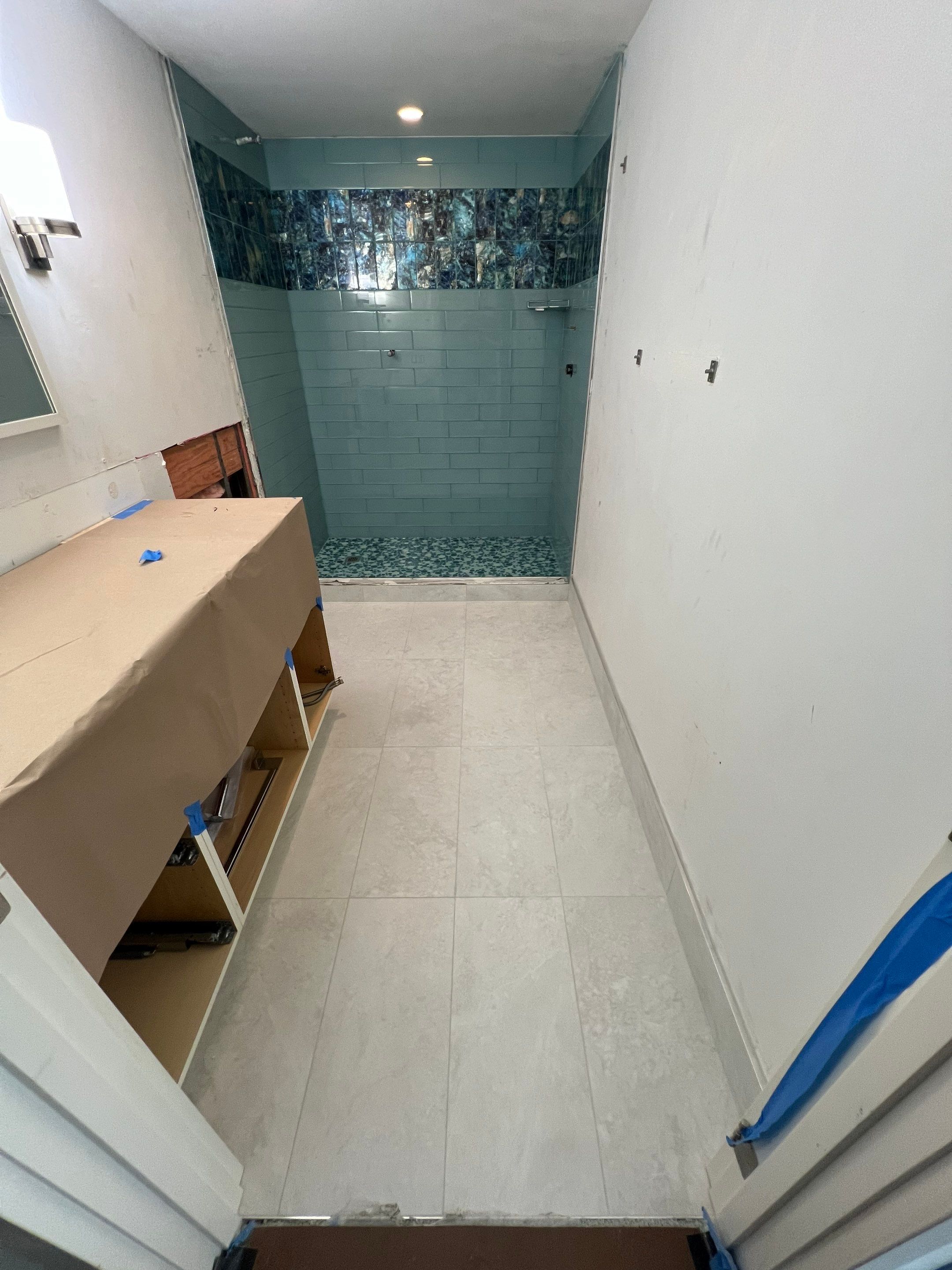 High-Rise Bathroom Remodel by Naples Flooring Boutique
