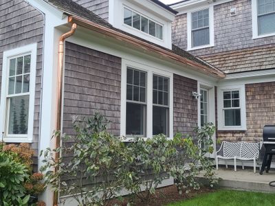 Gutter Installation using 6" Half Round Copper Gutter and Vinyl wedge buildout