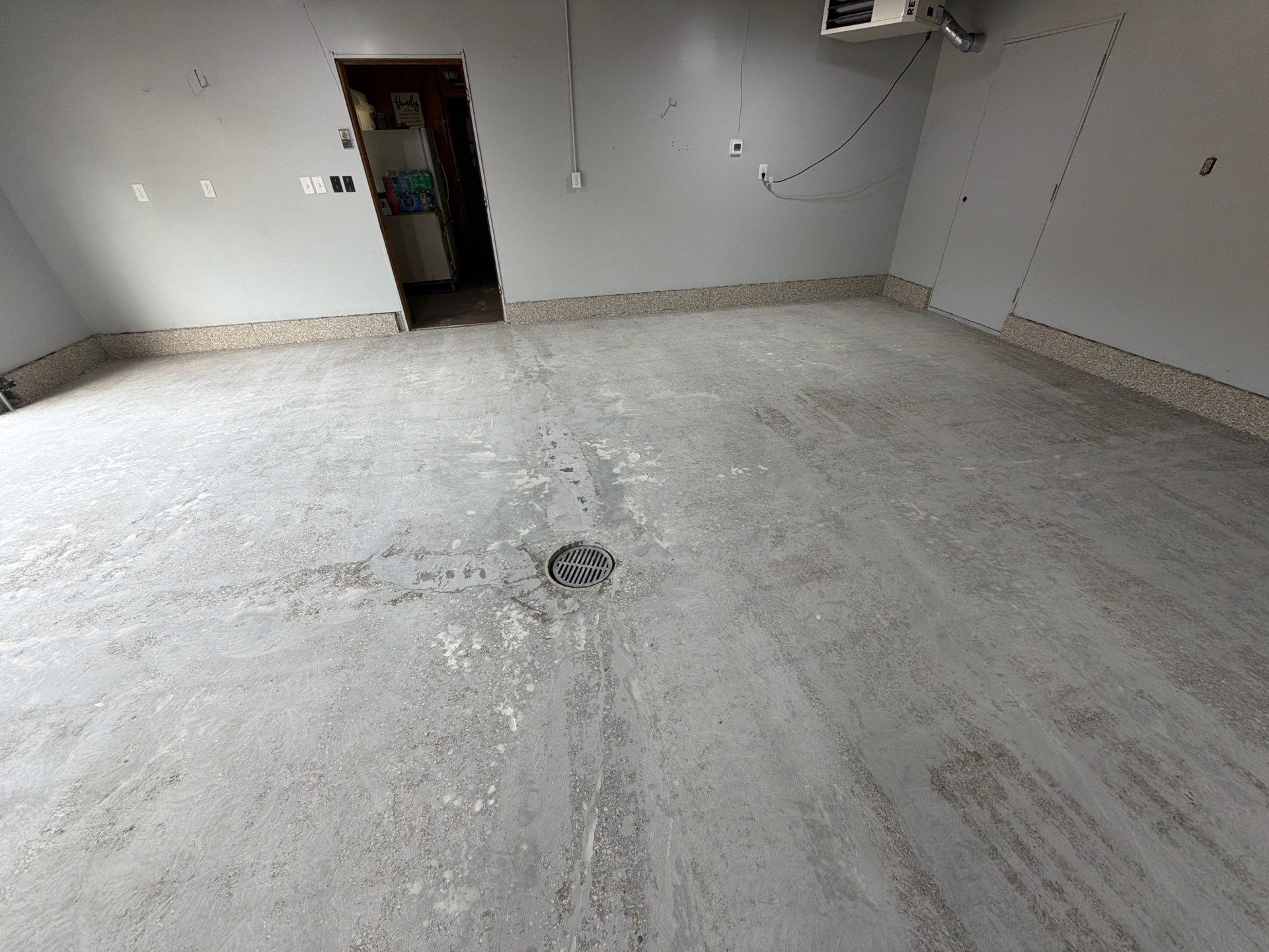Garage Epoxy Flake Floor Installation and Exterior Siding Repairs in Muskegon by Gordon Painting