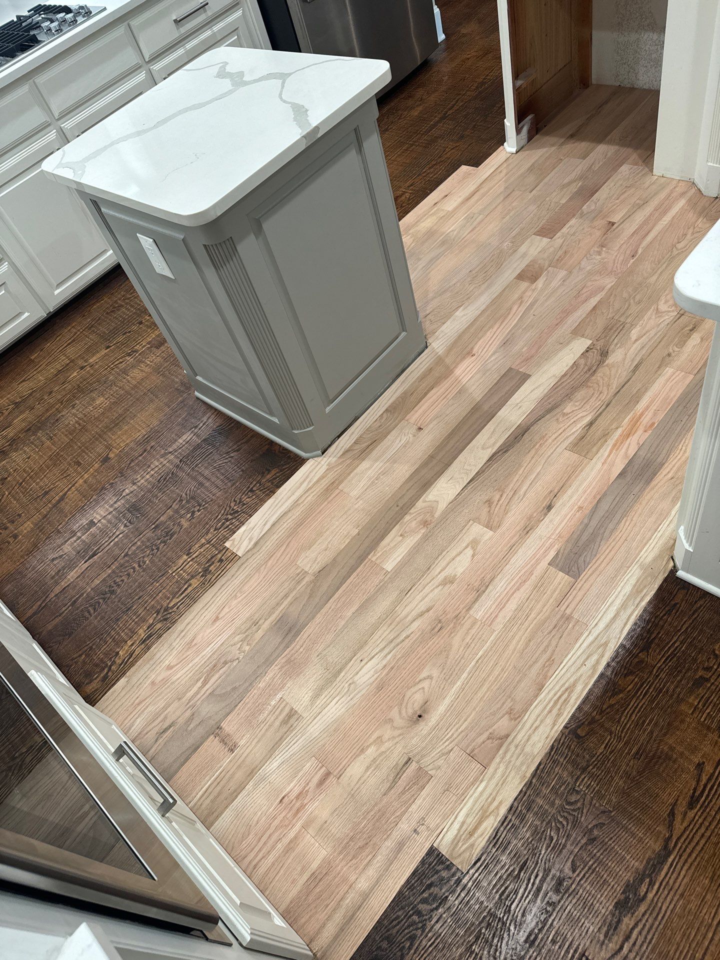 Dishwasher Flood Repair by Fine Line Flooring Inc.