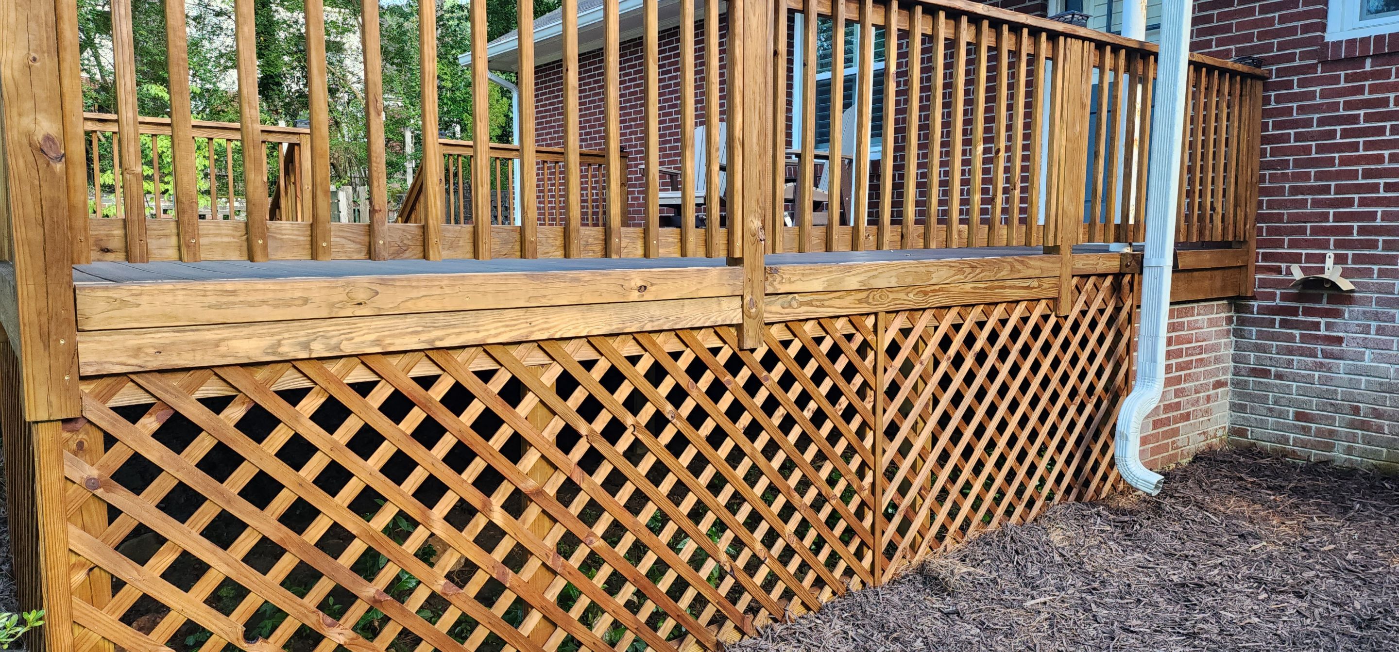 Deck Staining using Walnut by SSE by Titans of Timber Fence & Stain