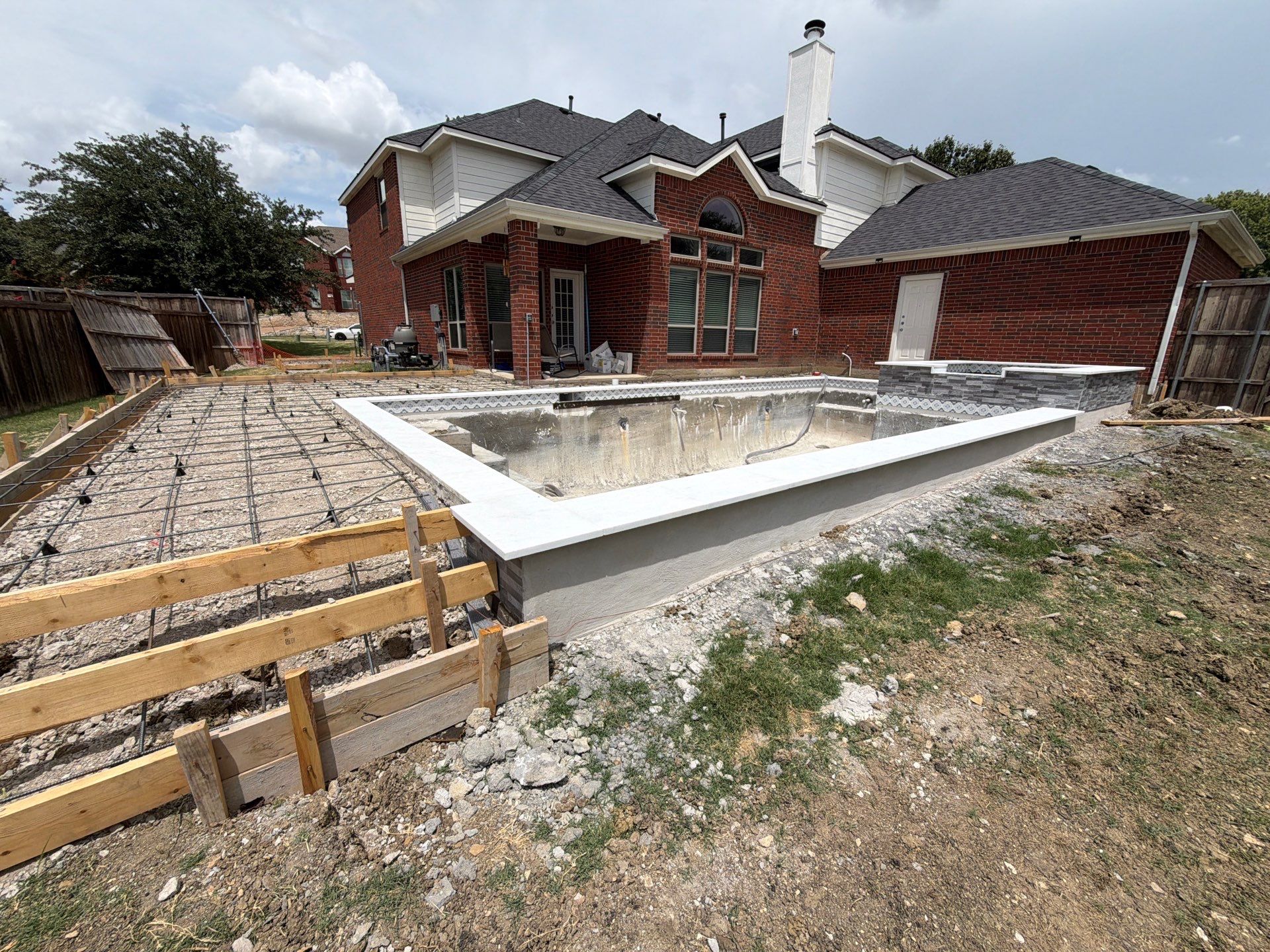 Geometric Pool with Raised Spa and Sun Shelf by Pinnacle Pools and Spas - DFW