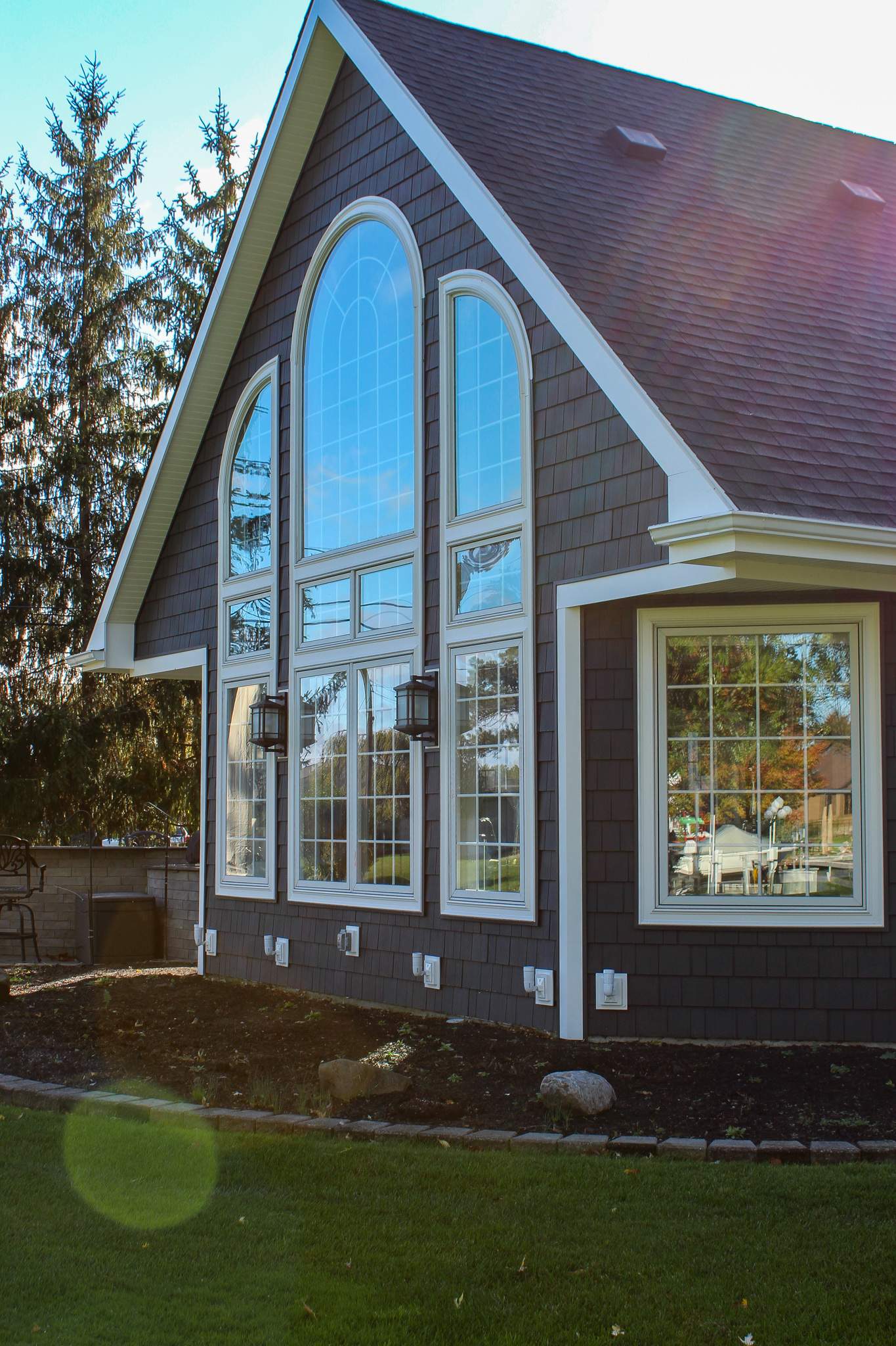 Exterior Renovations- Siding, Concrete, Railings, and Entry Door  by Ivy Lea Construction