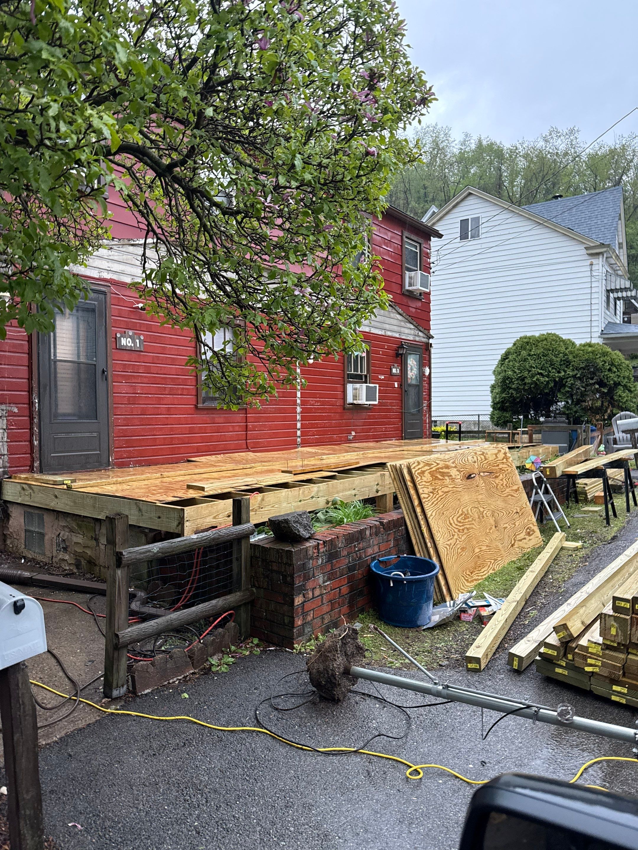 Roof sunspace deck  by Cousins Roofing Siding & Decks