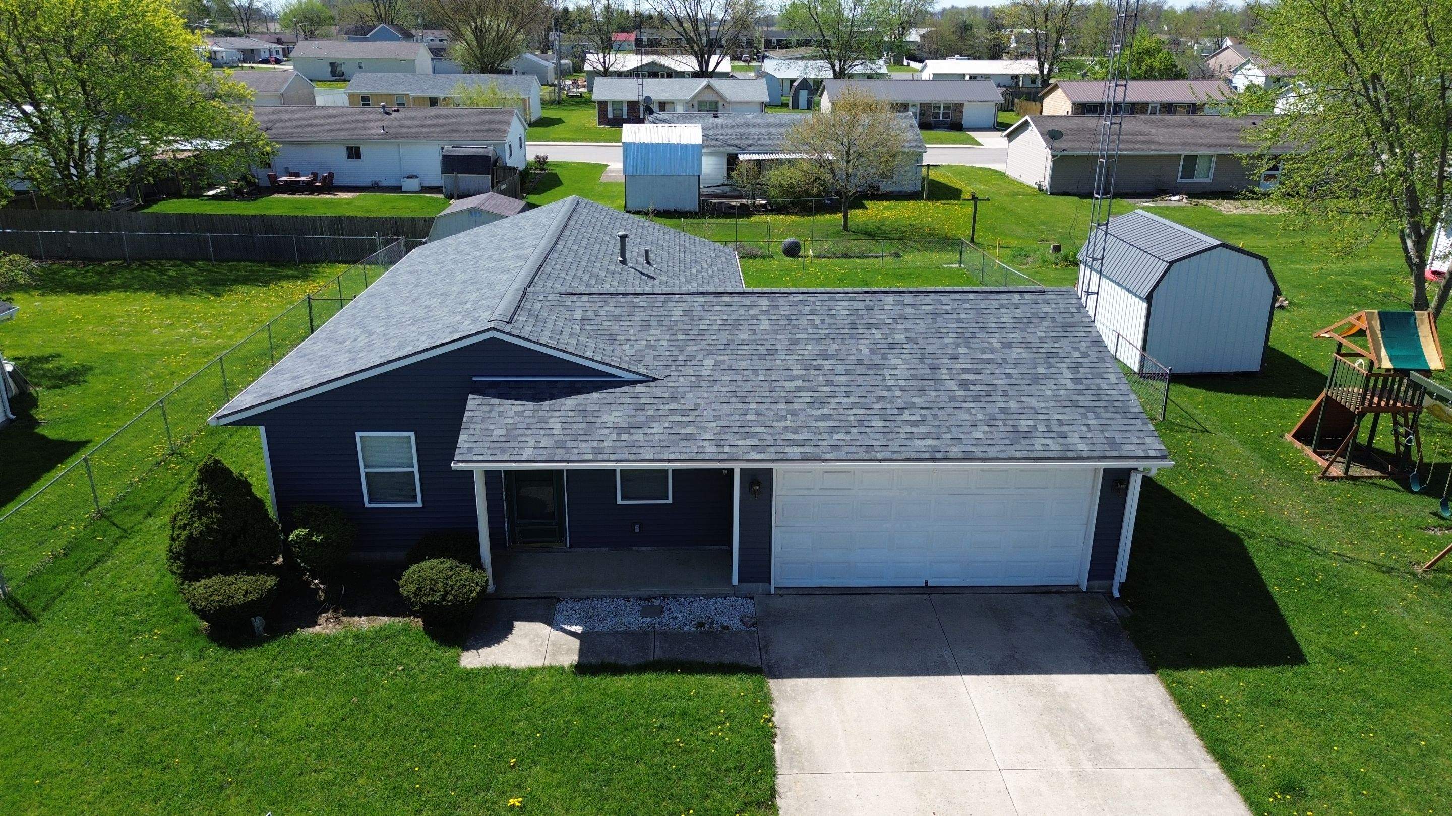 Storm Damage Residential Roof and Siding Installation by WIW Enterprises Inc
