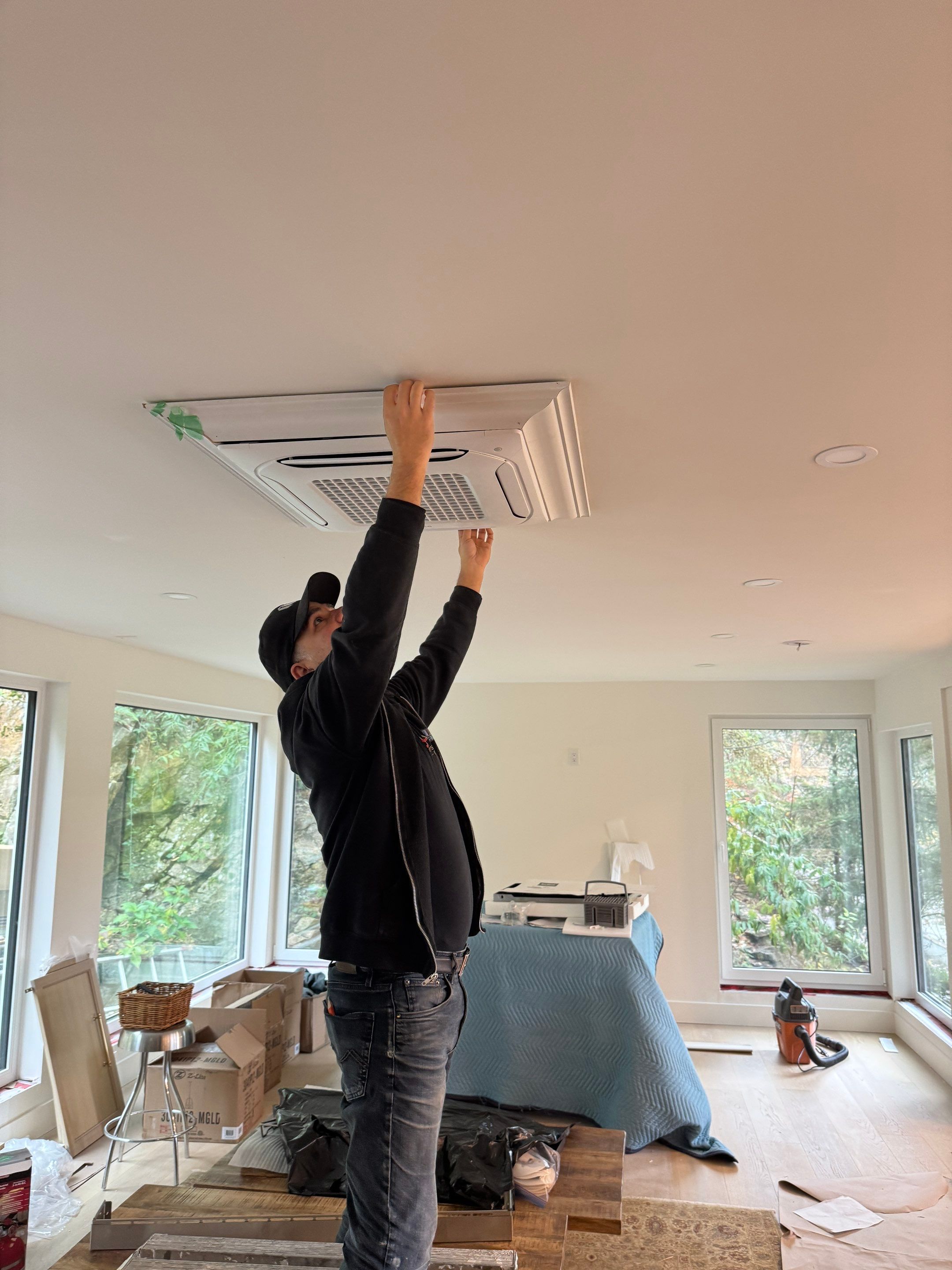 West Vancouver Custom Millwork: Heat Pump Trim & Window Finishing by YVR Construction Group