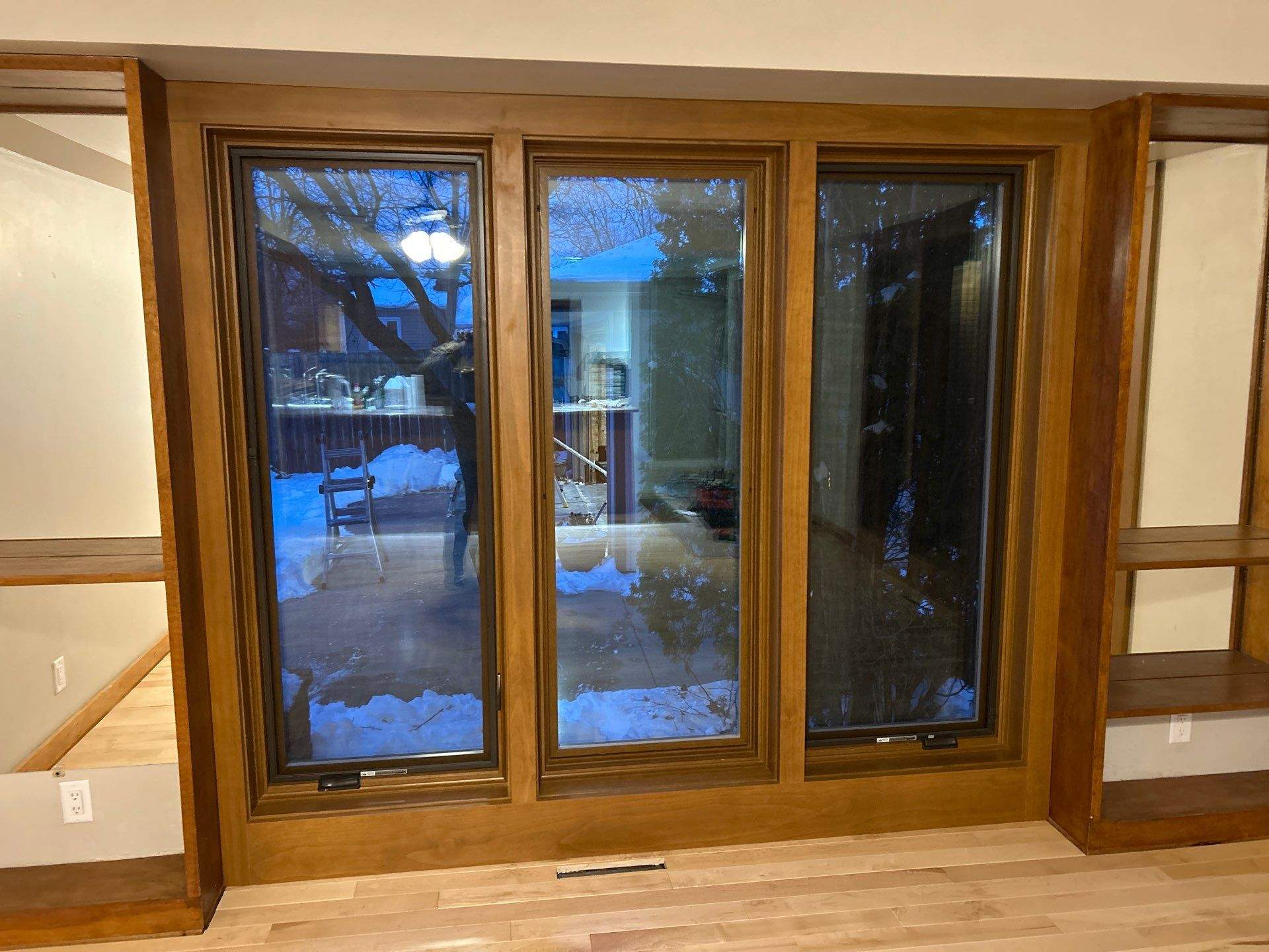 Black-Frame Pella Lifestyle Upgrade on a Partial Brick Home by United Windows and Siding LLC