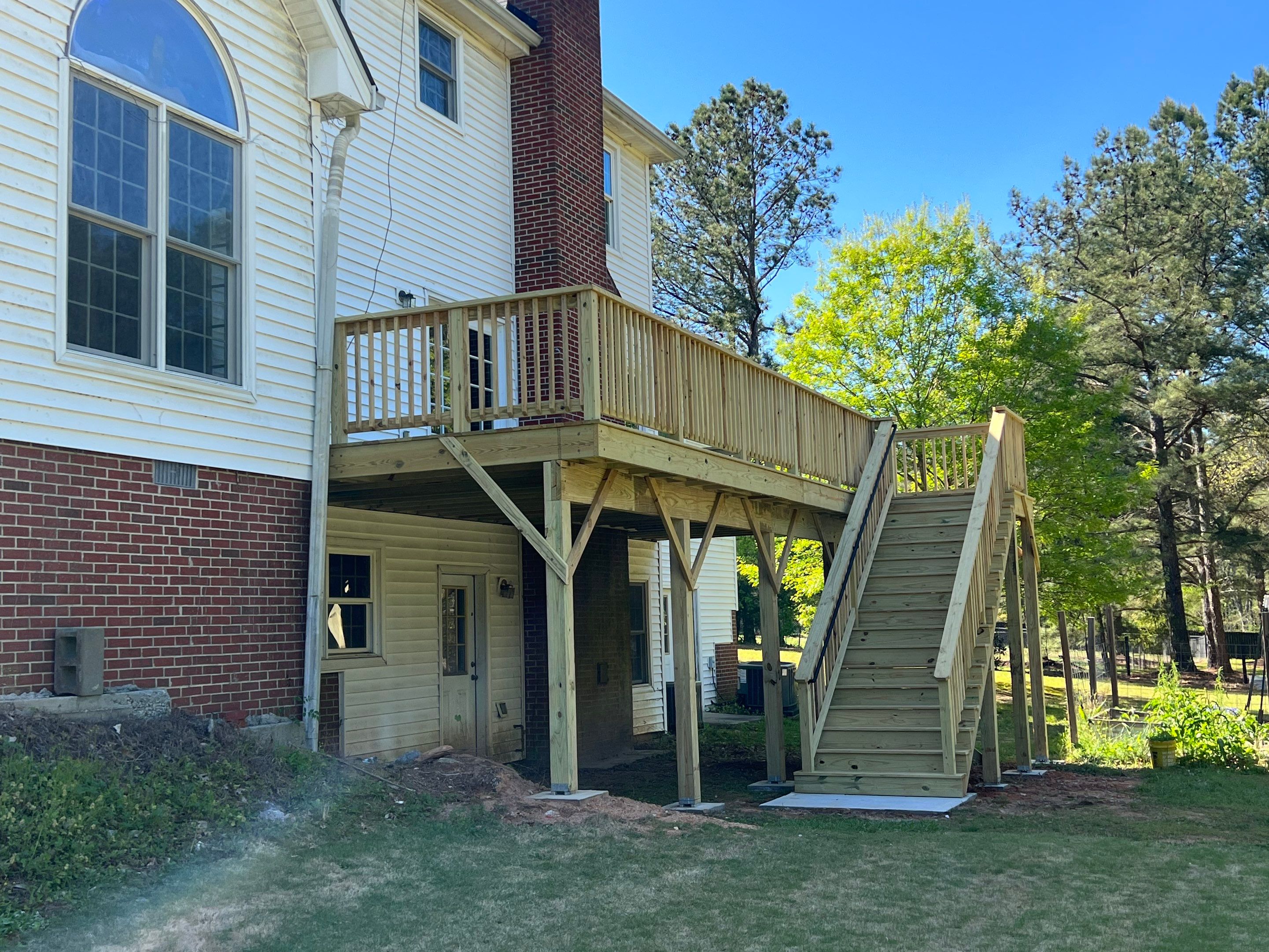 Pressure-Treated Wood Deck and Side Porch Replacement in Dacula by Swift Home Renovations