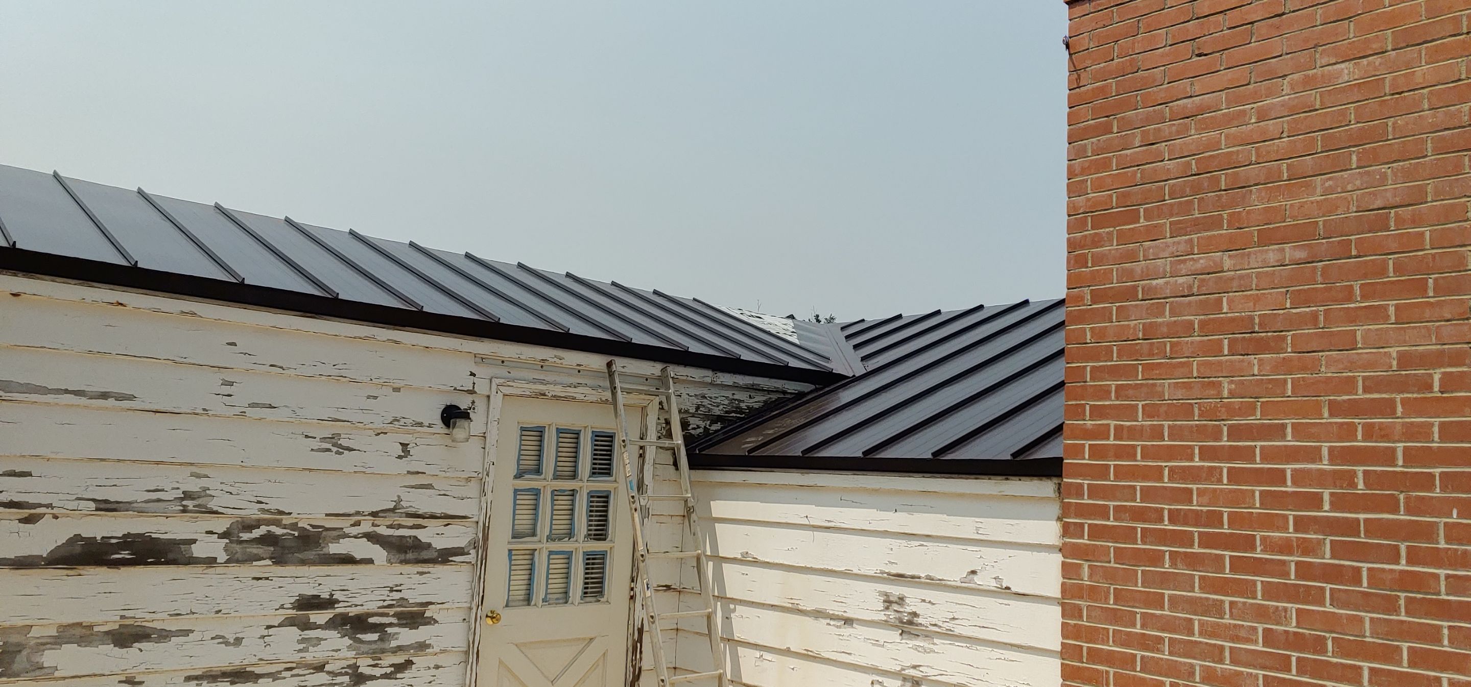 Residential Roofing Installation using Standing seam metal roofing system by Straight Edge Roofing Inc