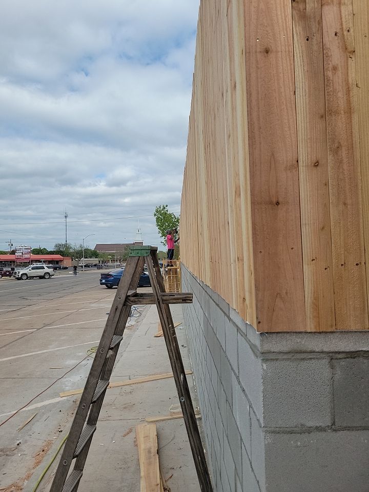 Cedar Fence using Cedar Pickets and Metal Poles by Clays Services Inc