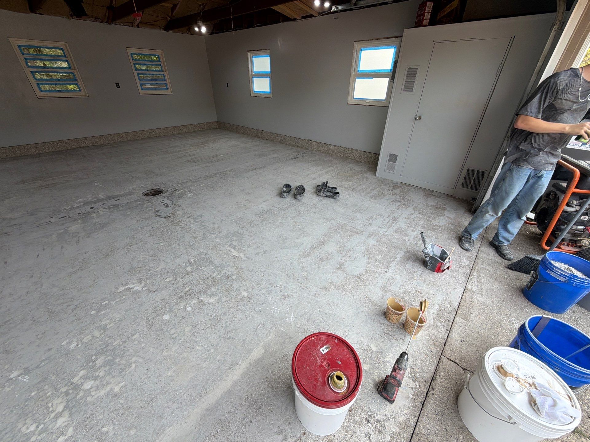 Garage Epoxy Flake Floor Installation and Exterior Siding Repairs in Muskegon by Gordon Painting