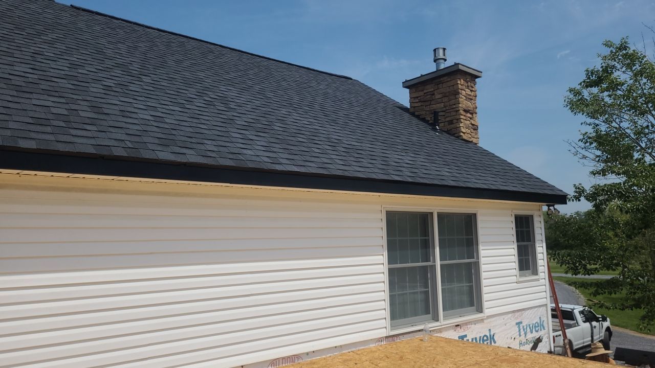 Roof Damage using Certainteed Lifetime Roofing System- Moire Black Landmark Pro shingkes with shadow ridge caps. by BulletpROOF Exteriors