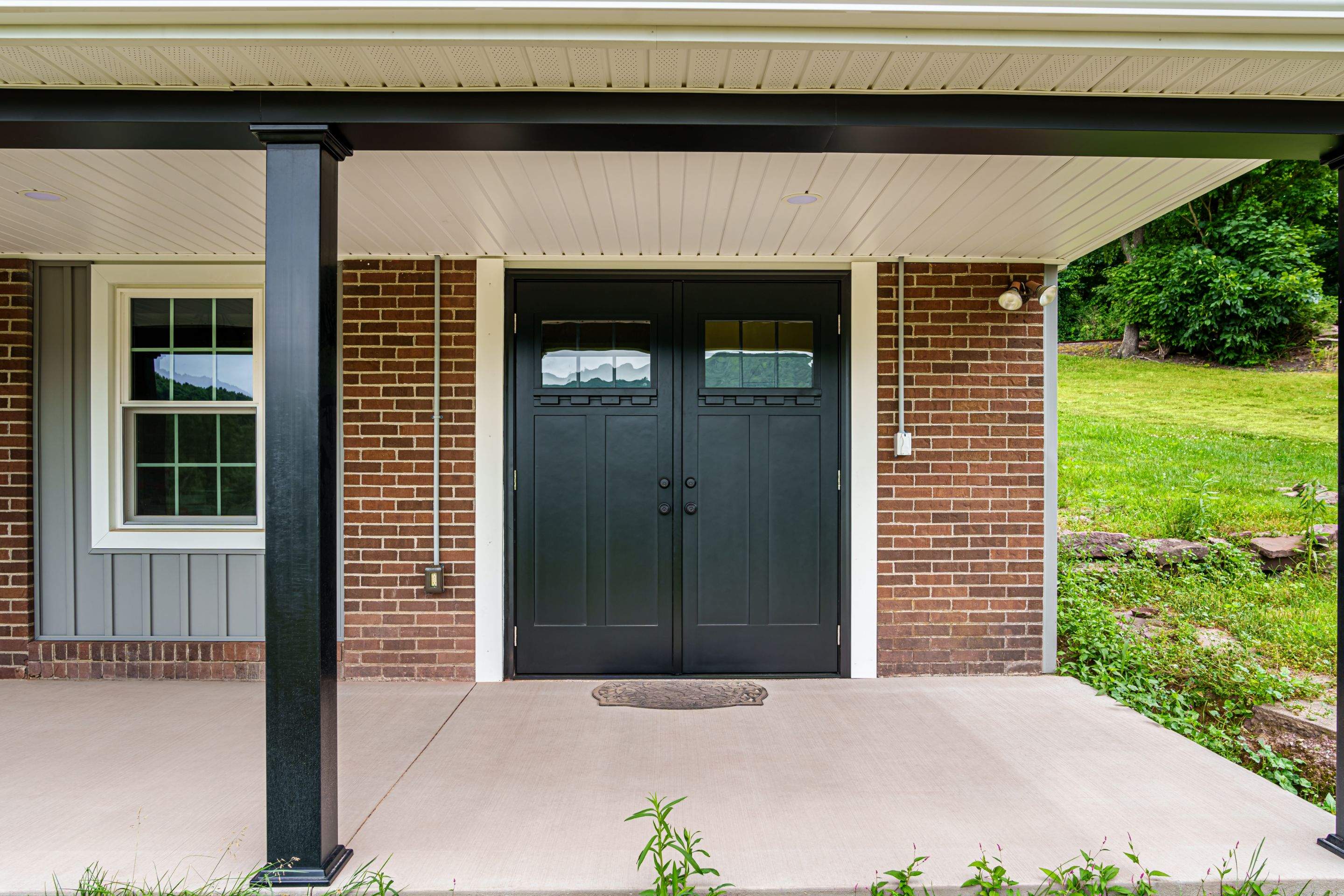New Metal roof and New siding by Esh Builders