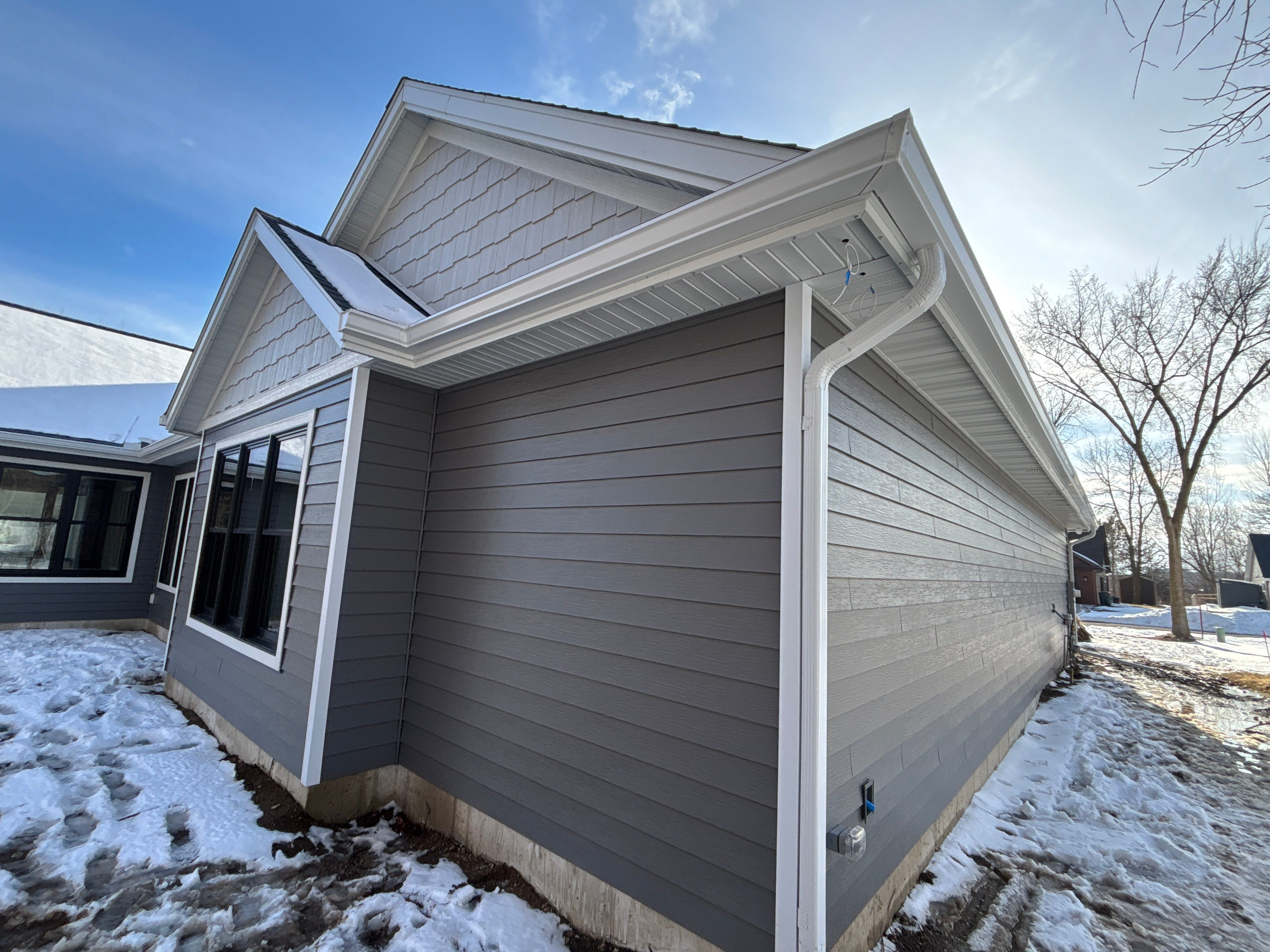 White Seamless Gutter and Gutter Guard Installation in Annandale by Next Level Seamless Gutters / Exteriors Inc.