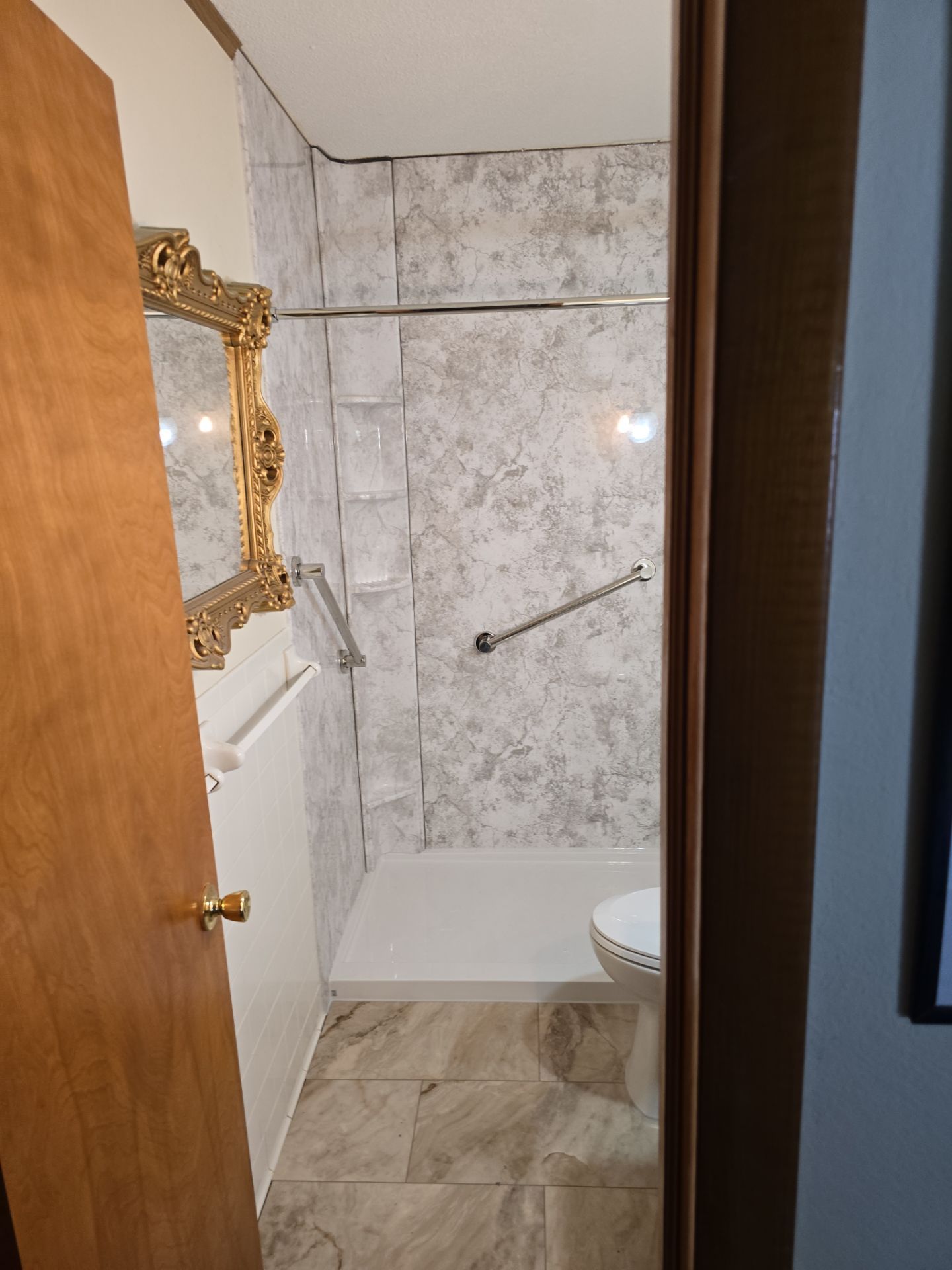Tub to Shower , flooring, and countertop by The Shower Company